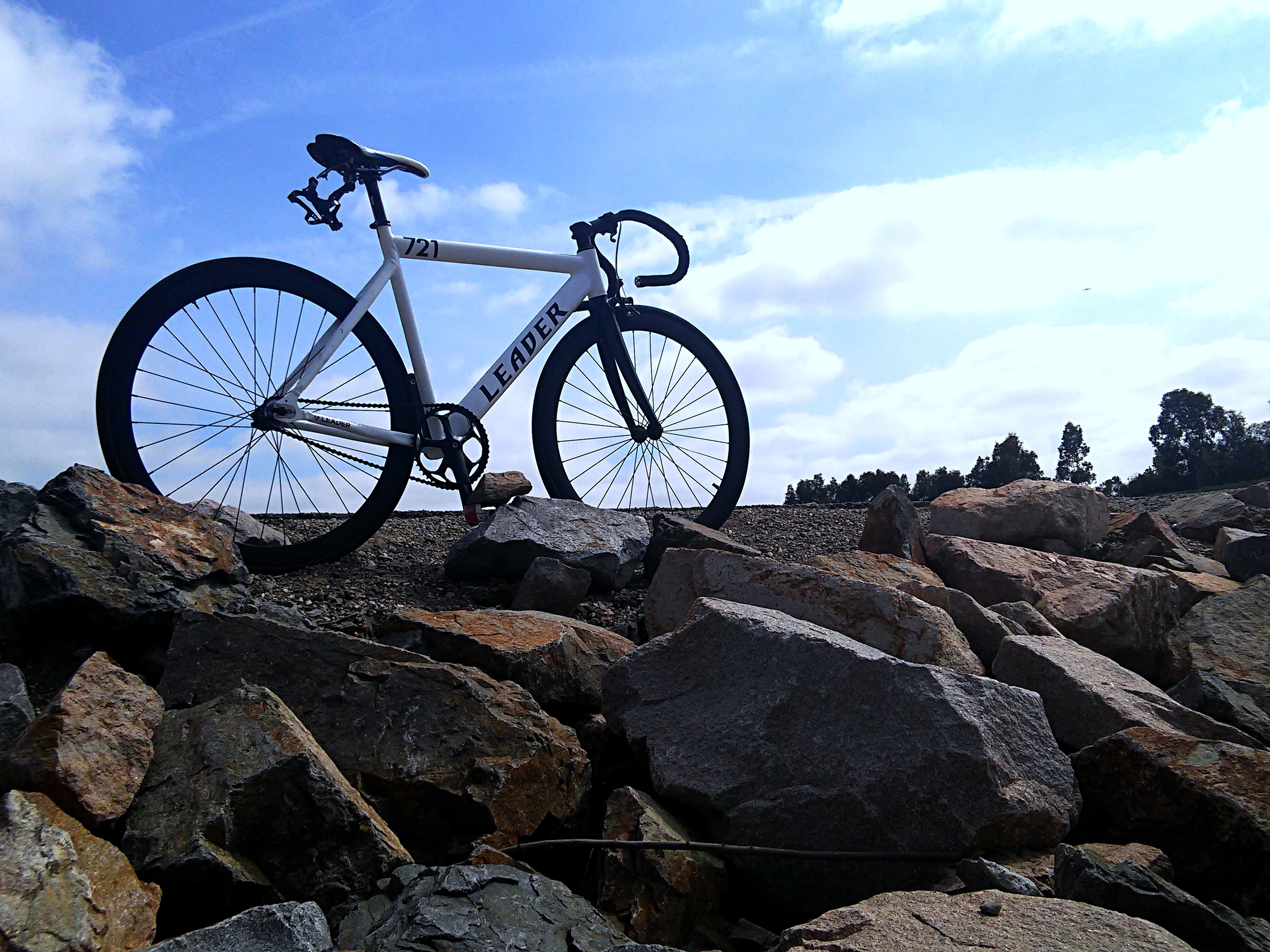 low angle view, lifestyle, blue, bike, leisure, silhouette, stones, sport, life, pebble, mode of transportation, cycle, healthy, cloud, biking, speed, way, HD Wallpaper