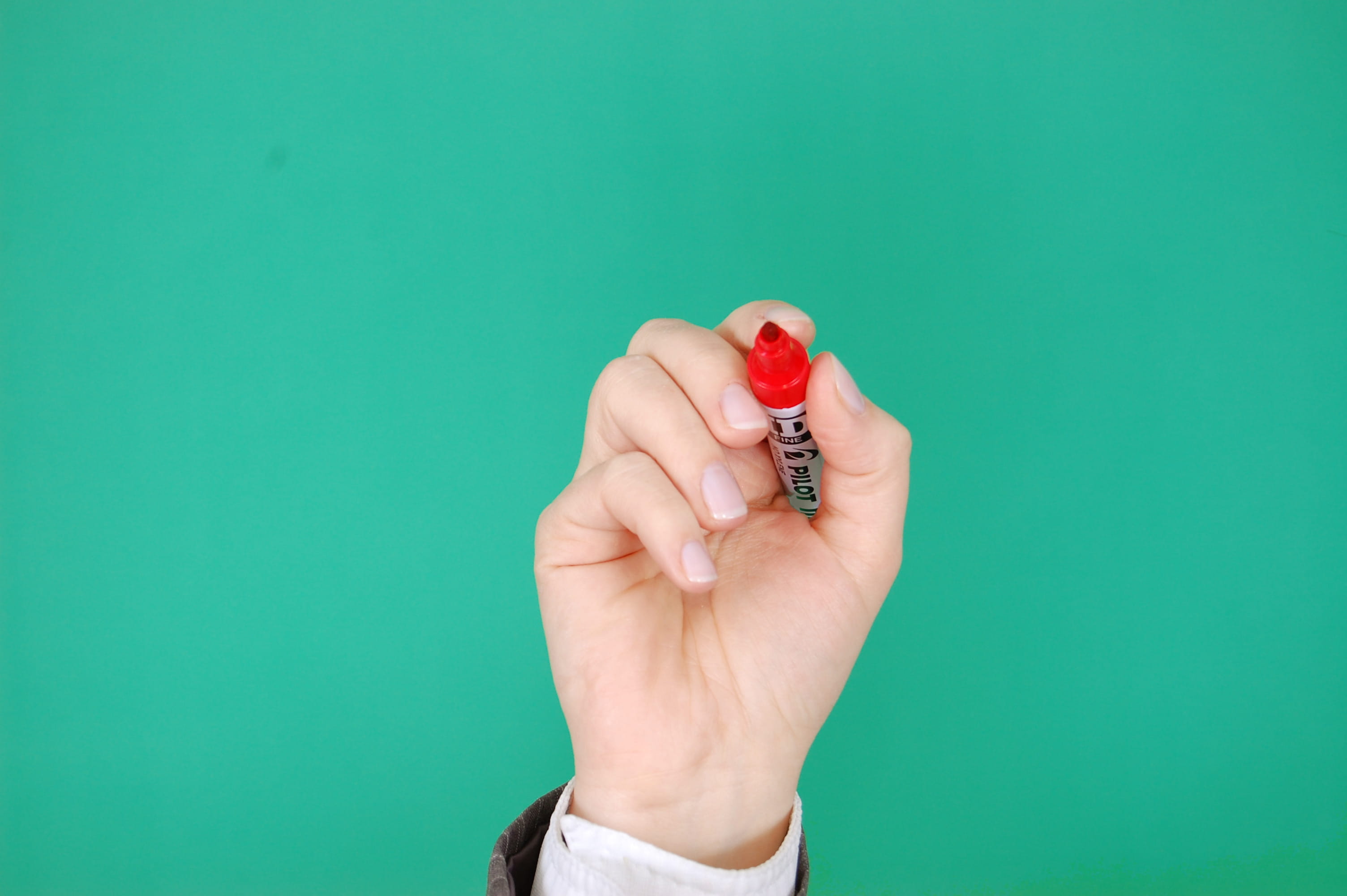 business, red, holding, turquoise colored, writing, green background, close-up, finger, human limb, presentation, indoors, write, human hand, body part, HD Wallpaper