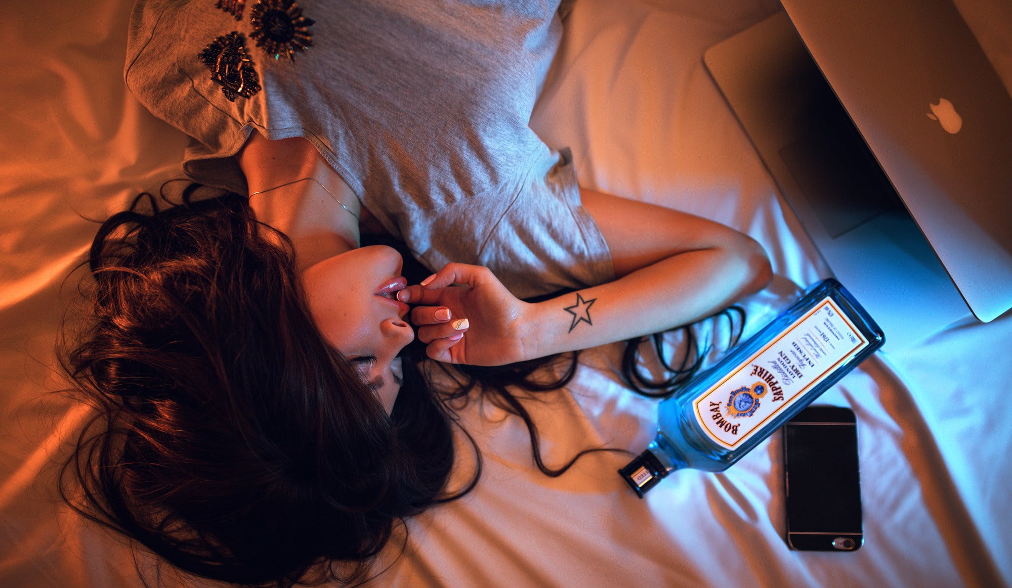 lying down, lifestyles, home interior, adult, high angle view, open mouth, technology, iPhone, leisure activity, brunette, 1080P, bedroom, young adult, HD Wallpaper