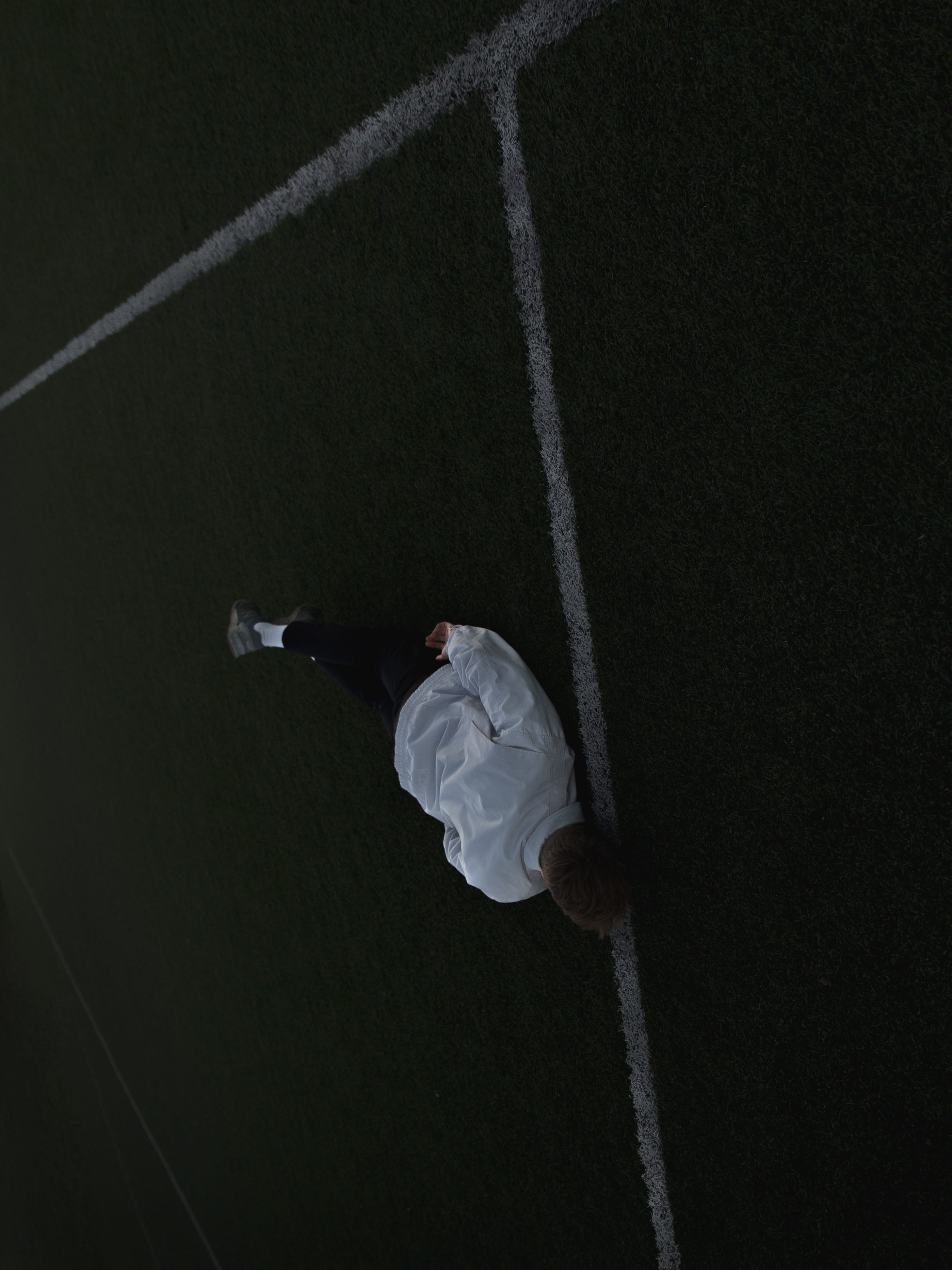 leisure activity, soccer, ground, rear view, guy, rope, mood, day, 2K, man, white, falling, moody, real people, outside, sport, lying, pitch, casual clothing, Phone HD Wallpaper