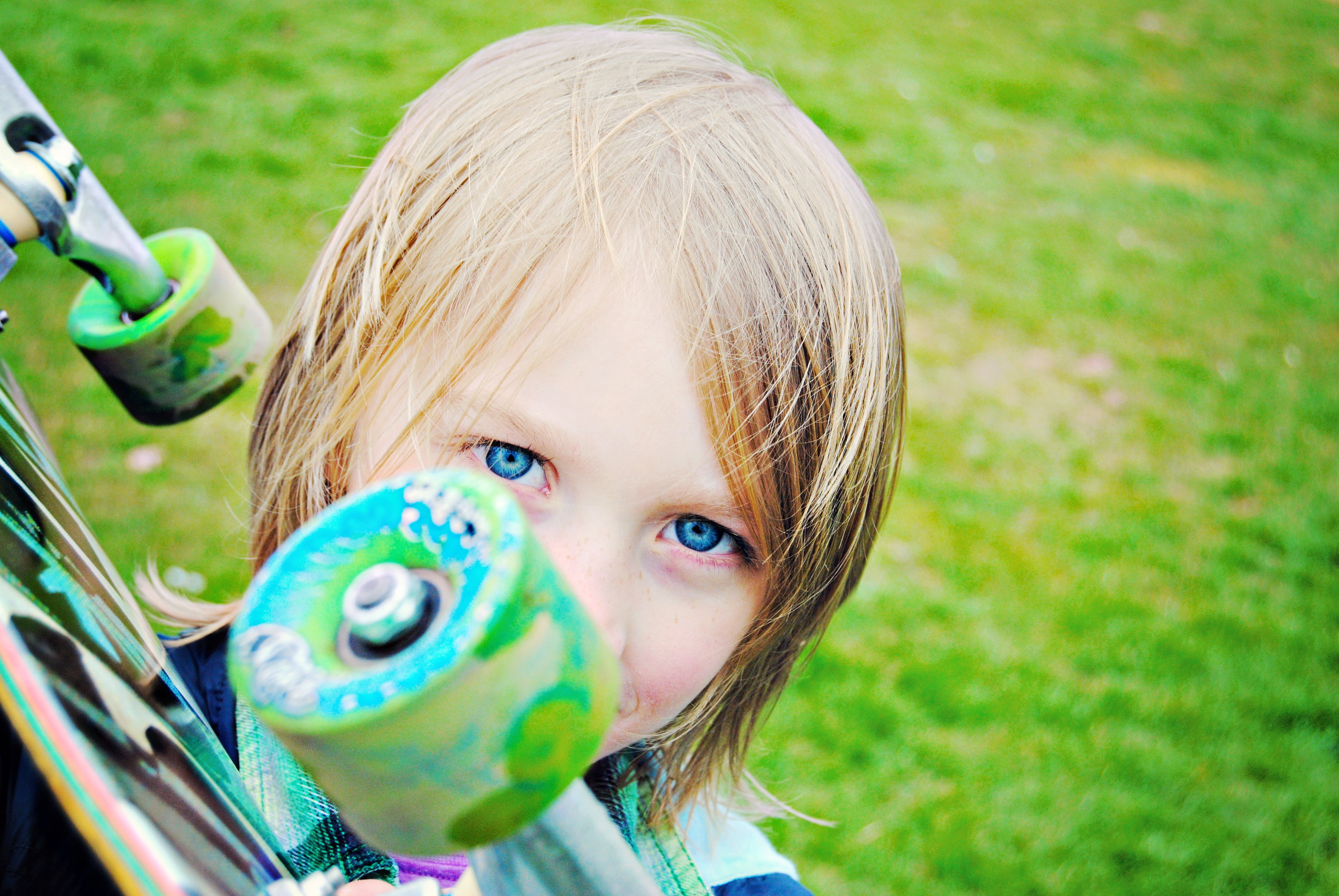 outdoors, cute, holding, blue eyes, skateboard, grass, childhood, day, cheerful, fun, happiness, playful, skate, people, vintage, blond Hair, playing, happy, HD Wallpaper