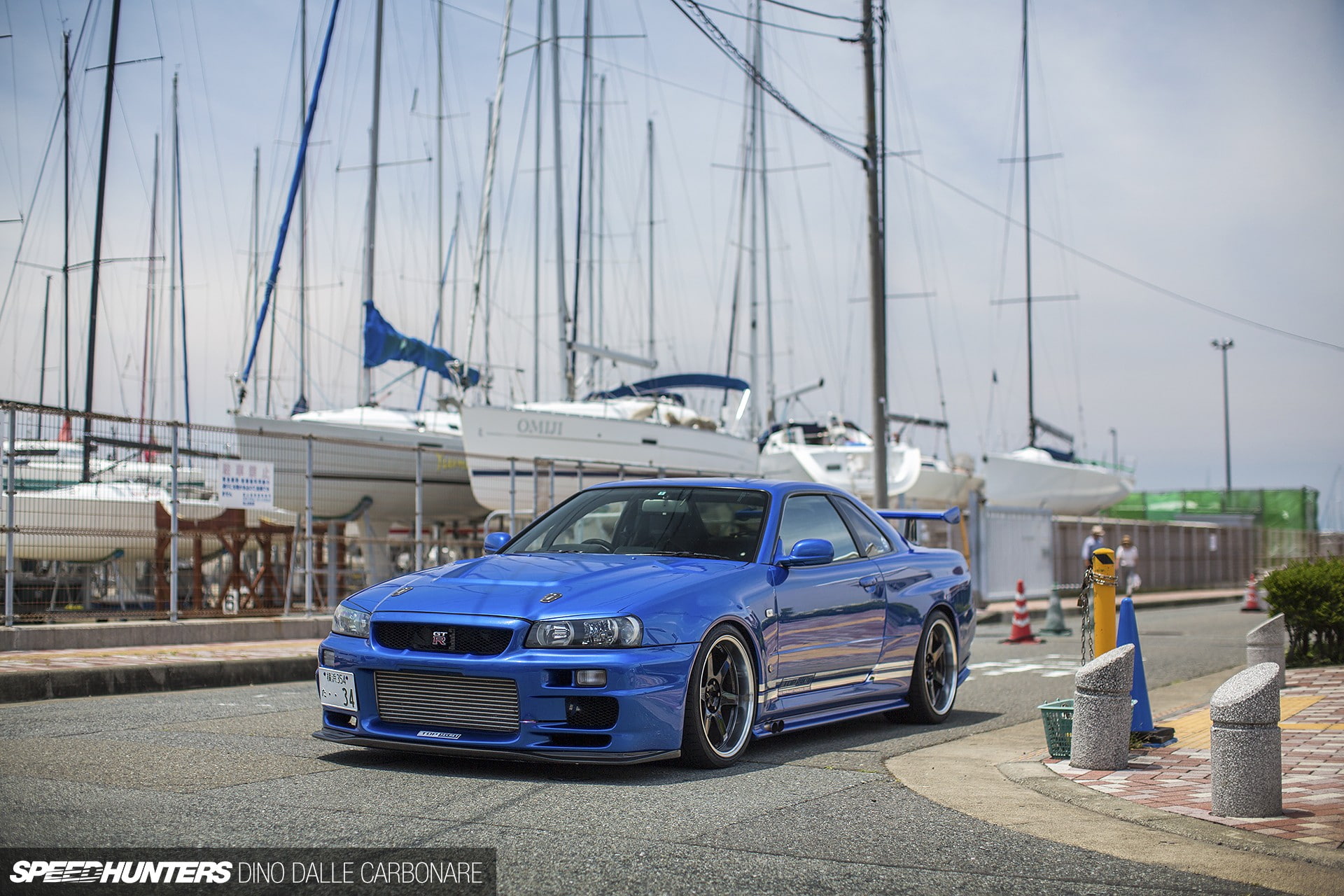 car, focus on foreground, nature, land vehicle, building exterior, incidental people, blue, outdoors, architecture, Nissan Skyline, 1080P, street, sky, HD Wallpaper