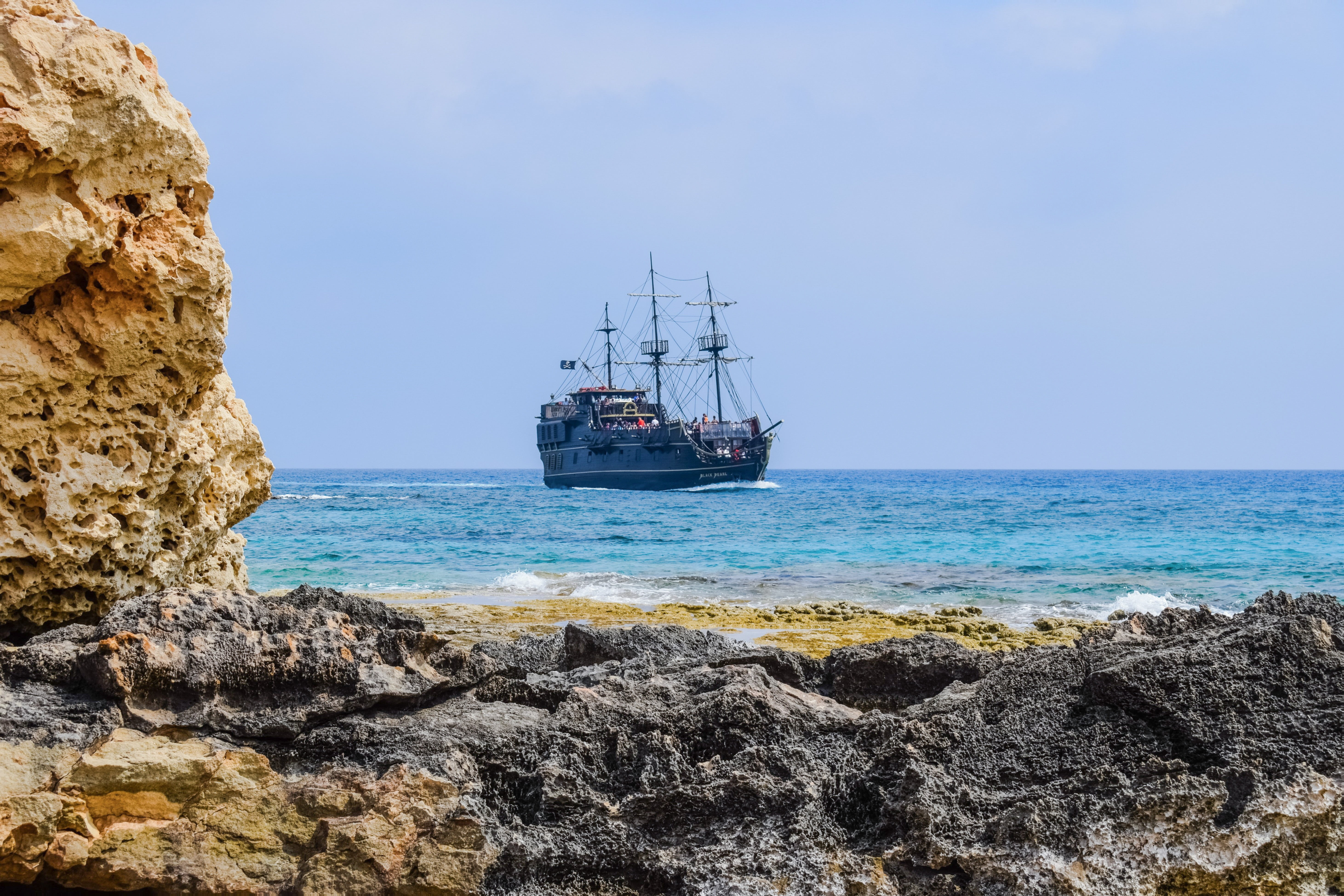beach, sky, pirate ship, beauty in nature, day, cruise ship, solid, nautical vessel, land, landscape, rock - object, outdoors, sailboat, passenger craft, HD Wallpaper