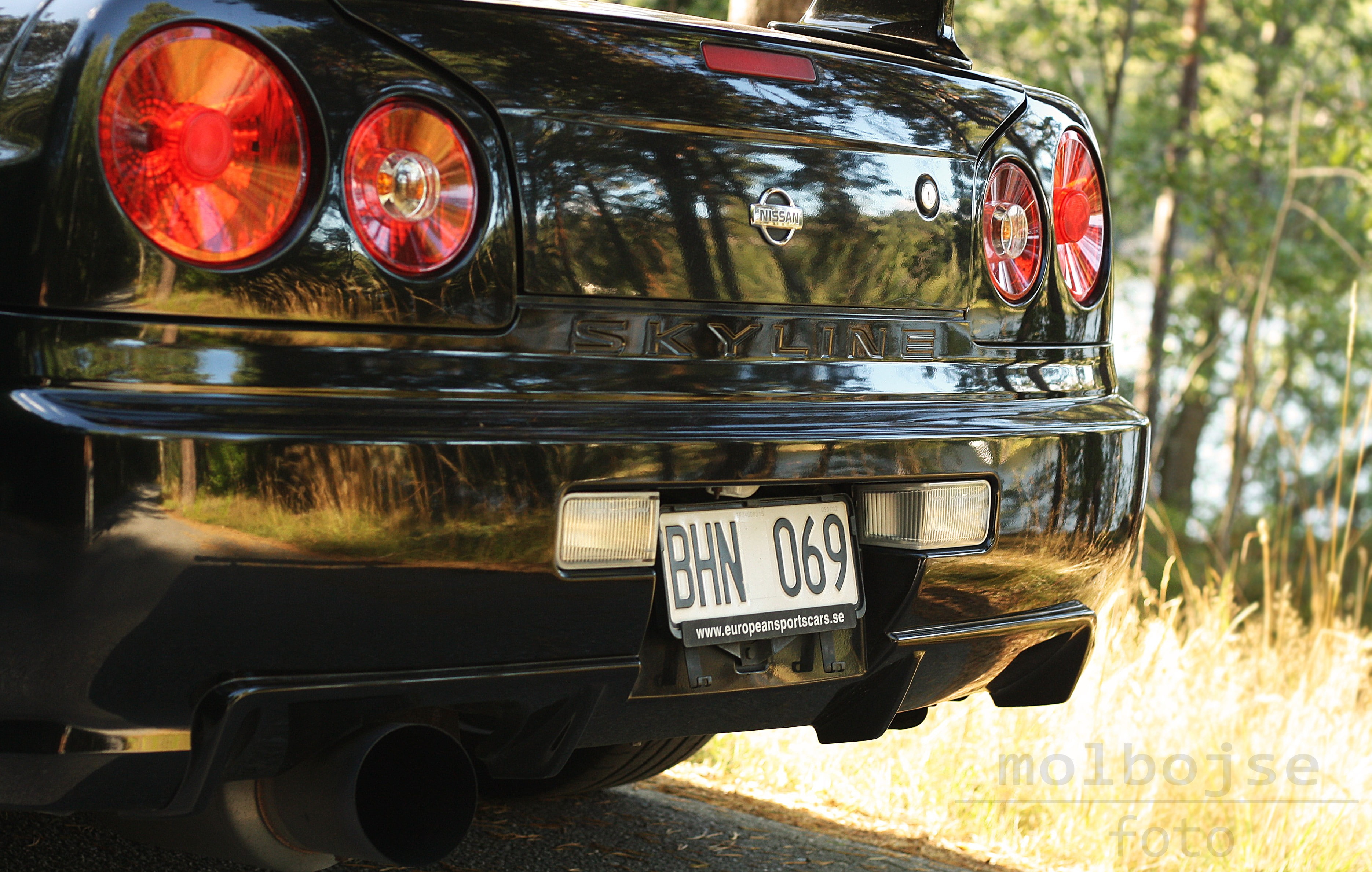 Nissan, day, wheel, mode of transportation, car, number, plant, headlight, skyline, land vehicle, no people, Black Pearl, 2K, reflection, stationary, Nissan Skyline GT-R R34, HD Wallpaper