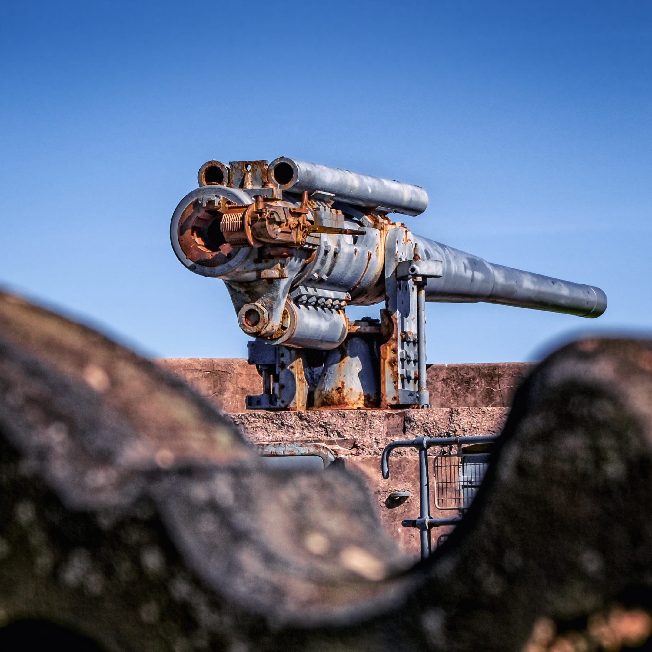 security, cannon, focus on background, building exterior, armed, day, architecture, weapon, War, selective focus, steel, rusty, Military, warfare, marine, Phone HD Wallpaper
