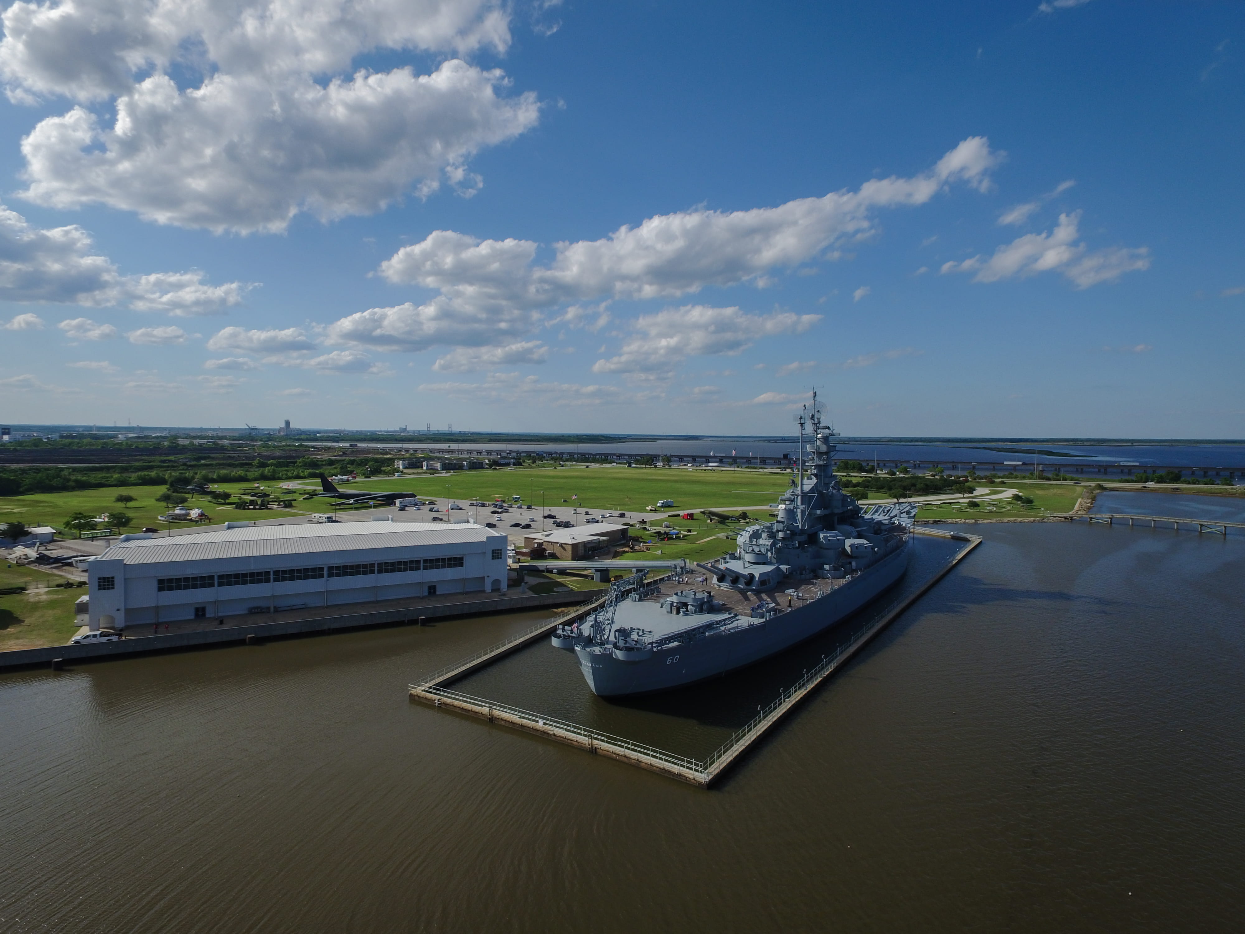 drone, 4K, architecture, built structure, sea, planes, city, mode of transportation, day, battleship, grass, military, battle, museum, travel, sky, park, HD Wallpaper