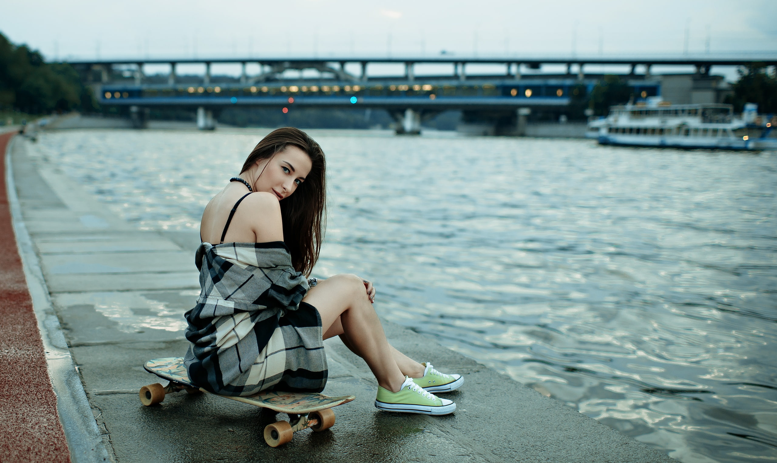 bare shoulders, brunette, bridge, 2K, looking at viewer, river, women, necklace, skateboard, model, plaid shirt, Converse, outdoors, portrait, sitting, HD Wallpaper