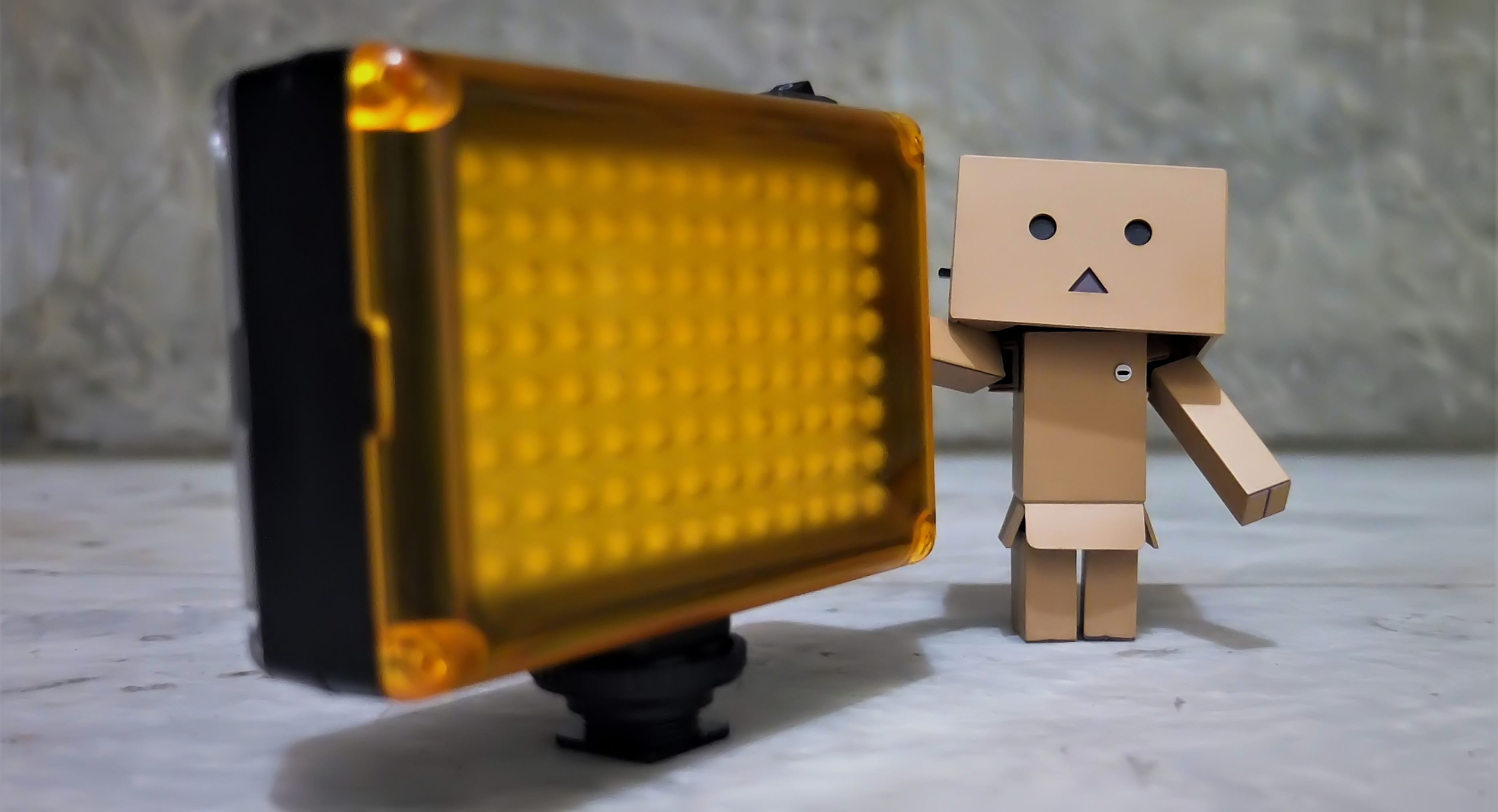cartoon, danboard, story, danbo, action, light, container, box, figurine, focus on foreground, box - container, television, still life, figure, yellow, HD Wallpaper