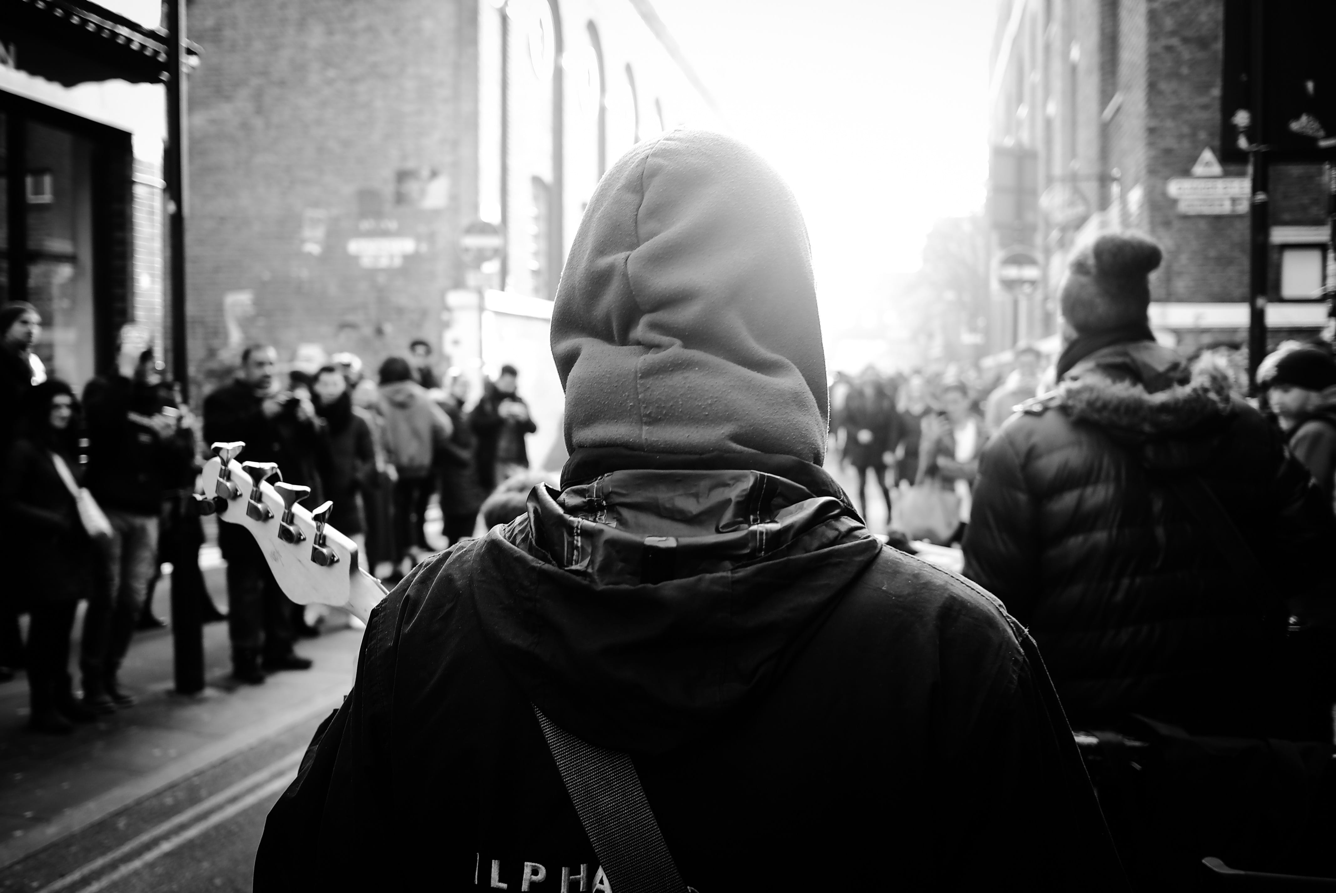 city Life, hood - clothing, adult, buildings, street, behind, incidental people, city street, day, building exterior, outdoors, real people, crowd, wearing, HD Wallpaper