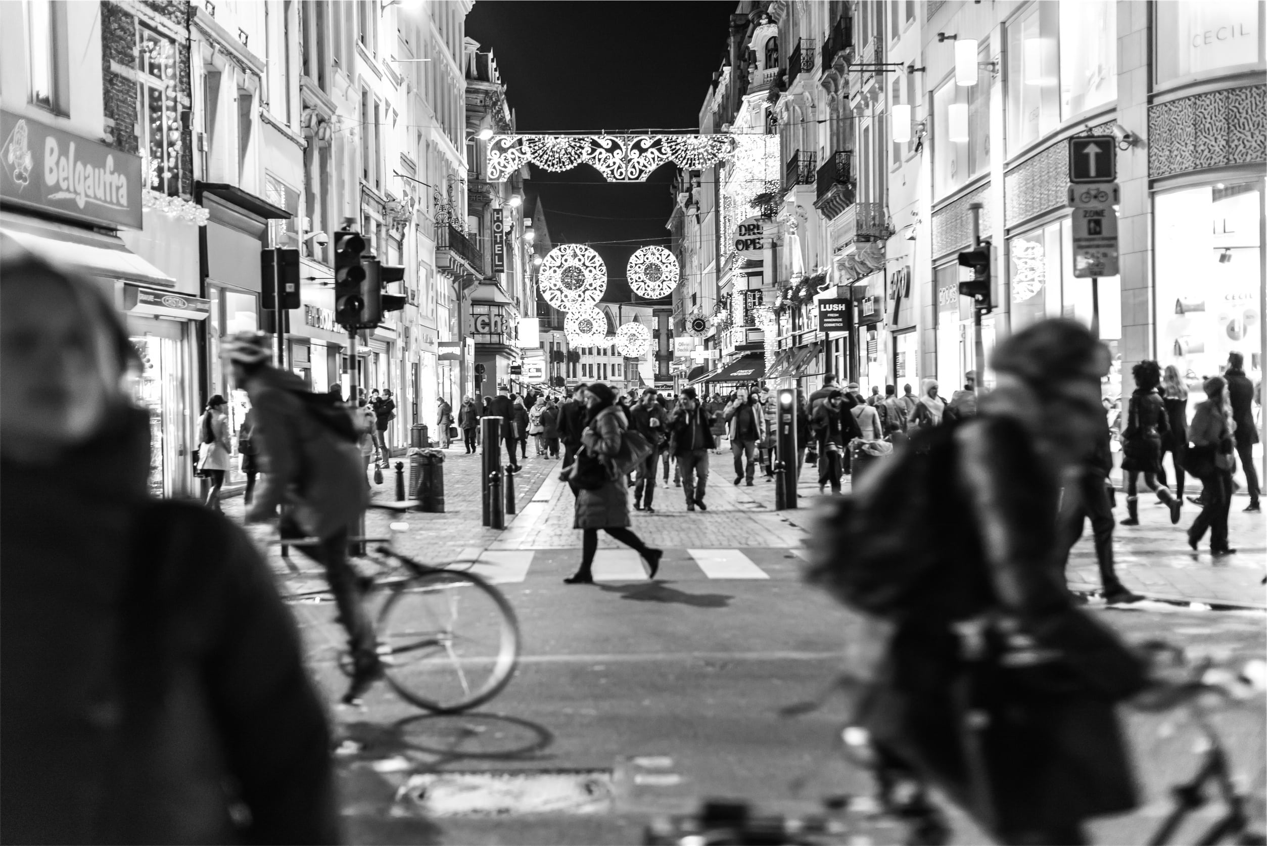biking, black And White, night, busy, outdoors, adult, city street, streets, signs, pedestrians, city, stores, walking, built structure, urban Scene, road, HD Wallpaper