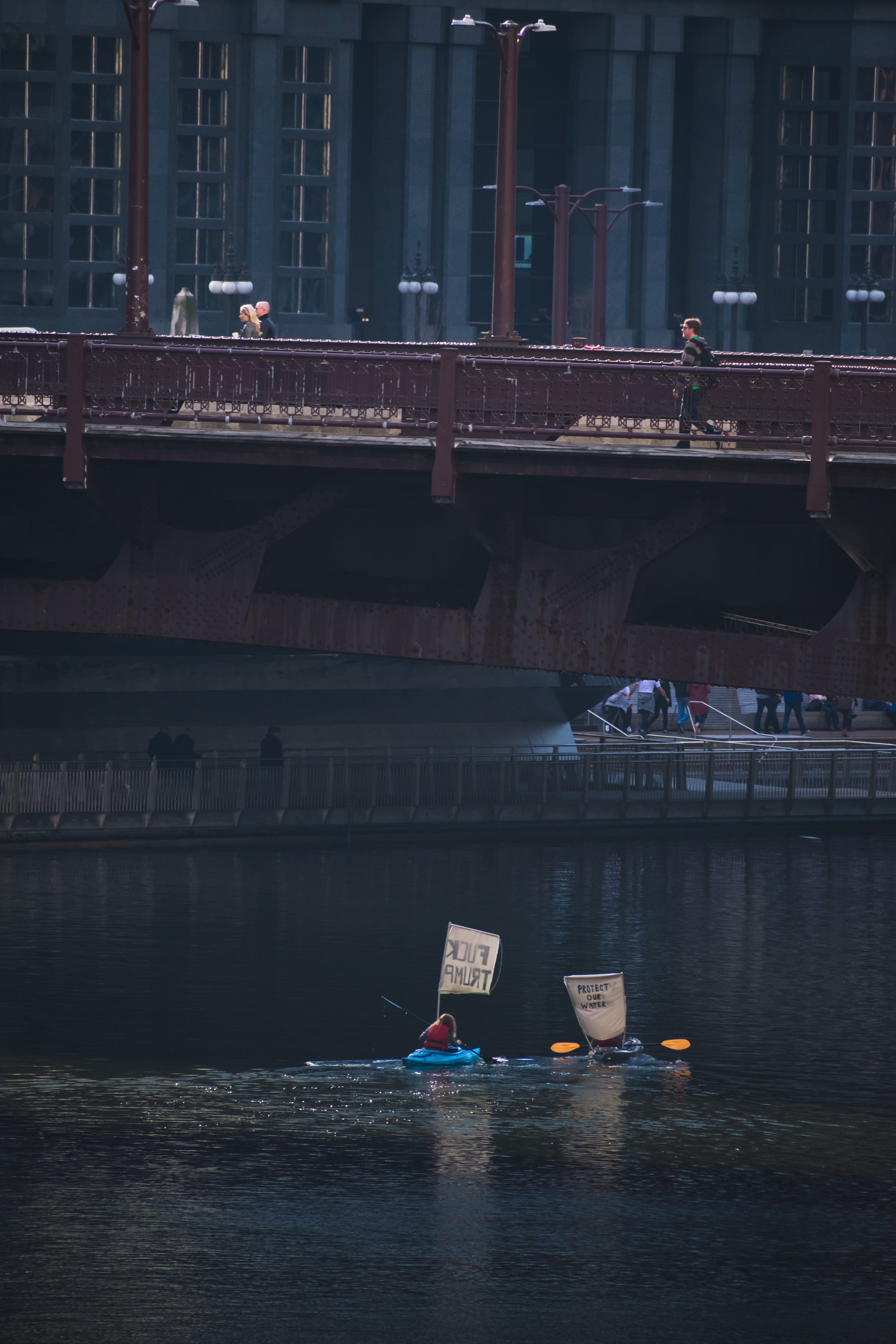 woman, bridge, city, transportation, photography, protest, built structure, waterfront, kayak, day, sign, river, connection, nature, chicago, water, building exterior, Phone HD Wallpaper