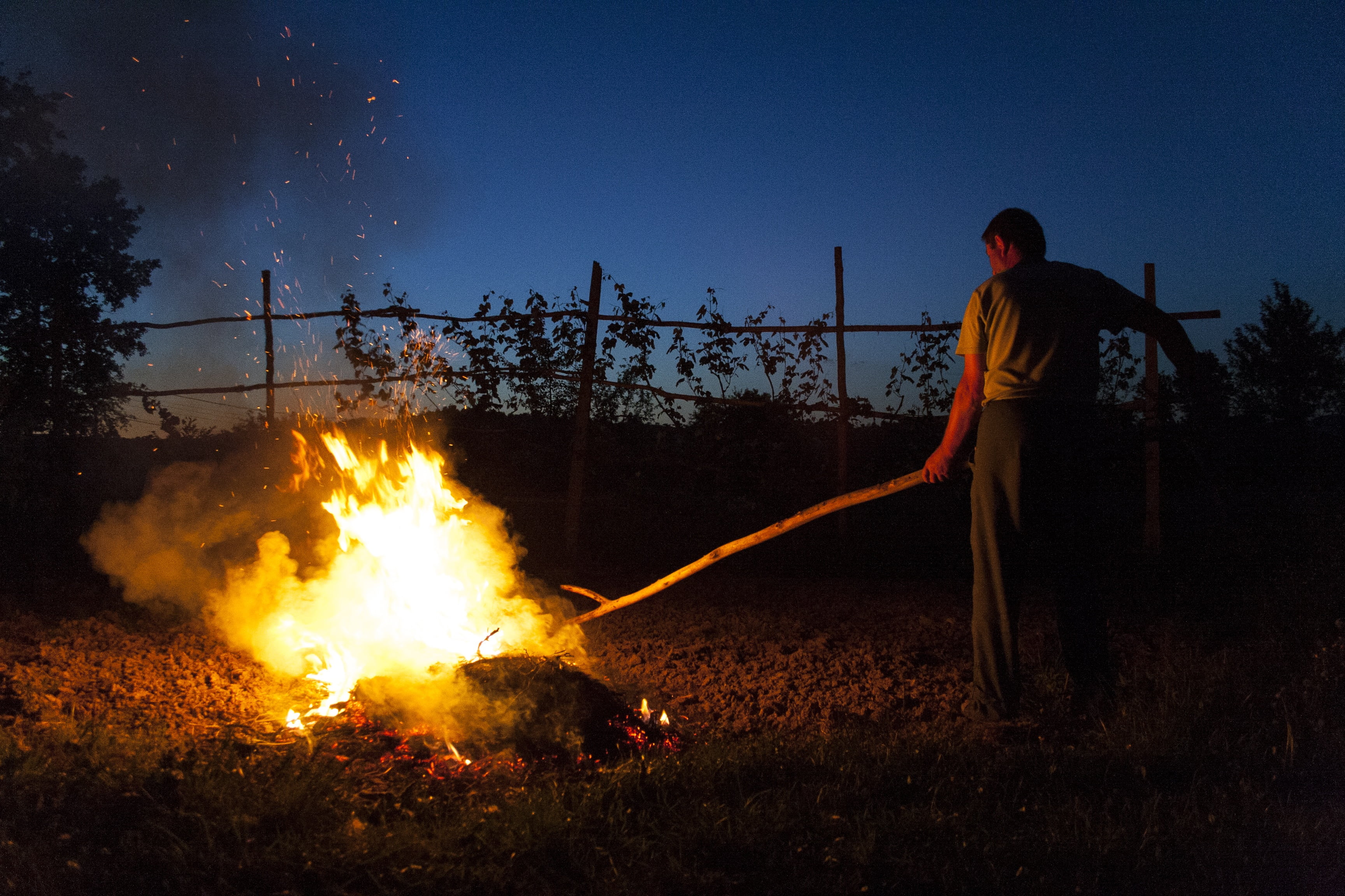 illuminated, hose, blue, people, fire - natural phenomenon, wood, occupation, communication, person, fire, men, nature, bonfire, yellow, fall, playing with fire, HD Wallpaper