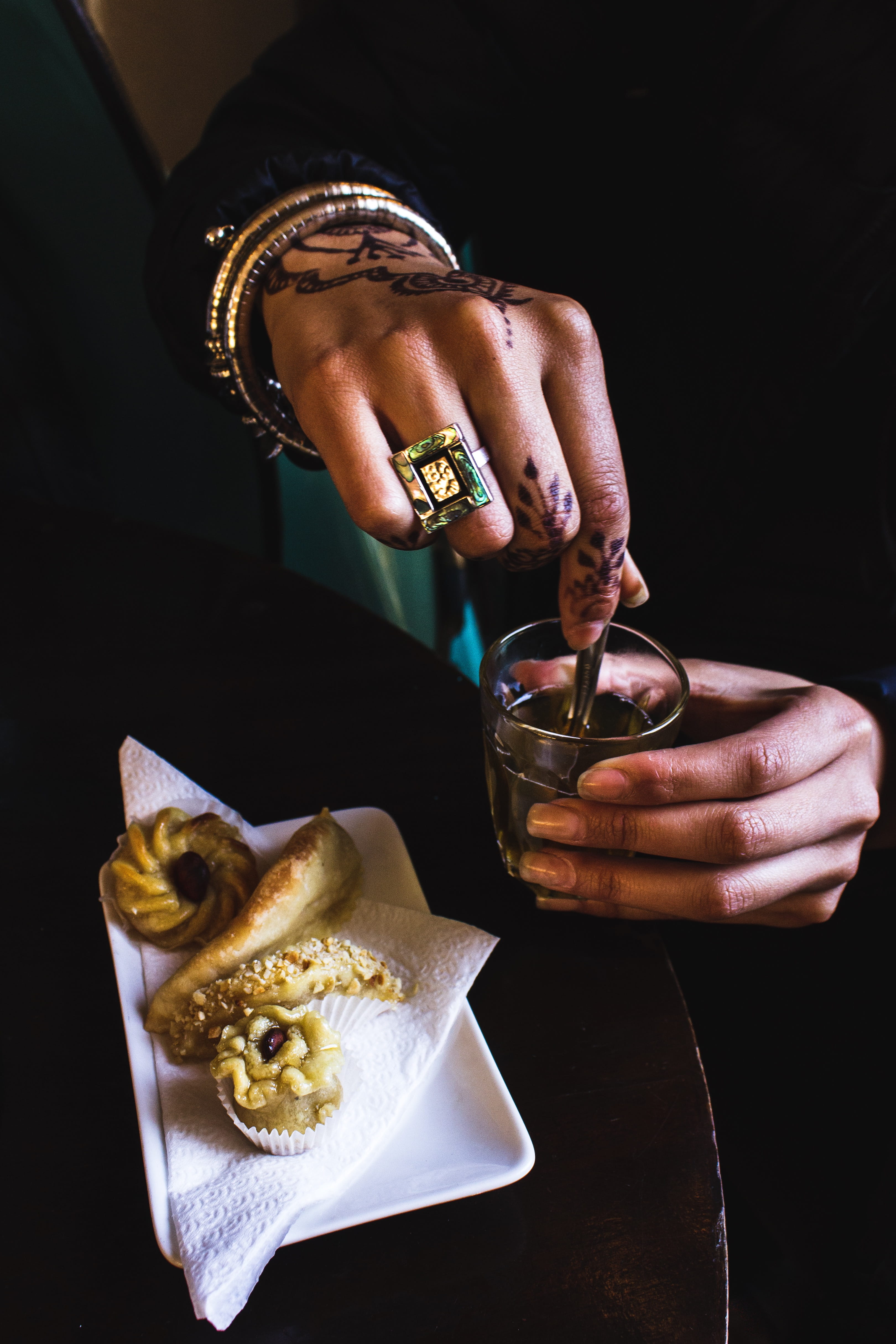 sweets, hand, bread, beer glass, finger, stirring, clear, dish, person, pastries, black background, cracker, refreshment, lifestyles, nail, cooked, indoors, Phone HD Wallpaper