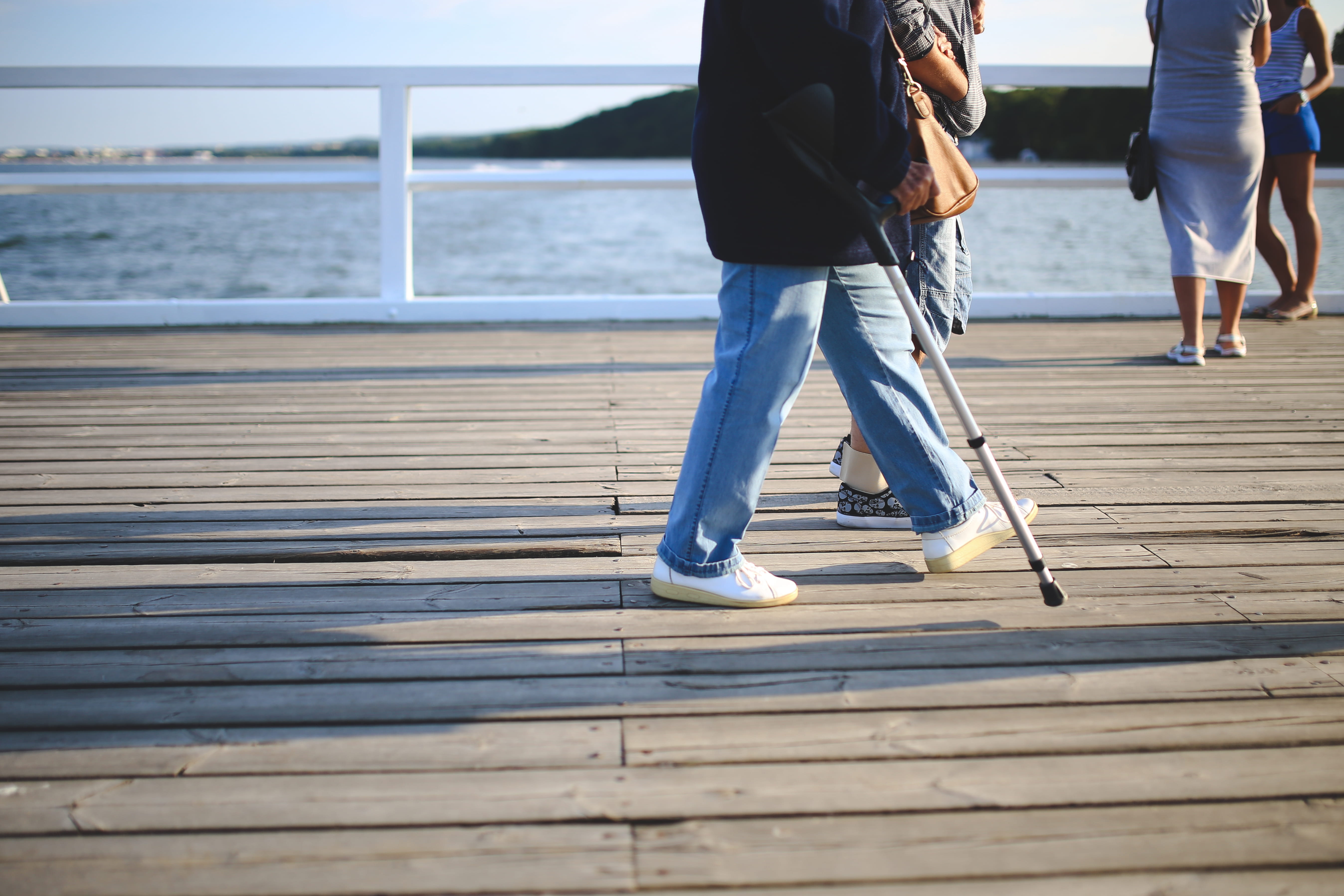human leg, standing, adult, sea, low section, ocean, hardworking, water, injury, men, nature, jeans, casual clothing, 5K, pier, people, vacation, woman, HD Wallpaper