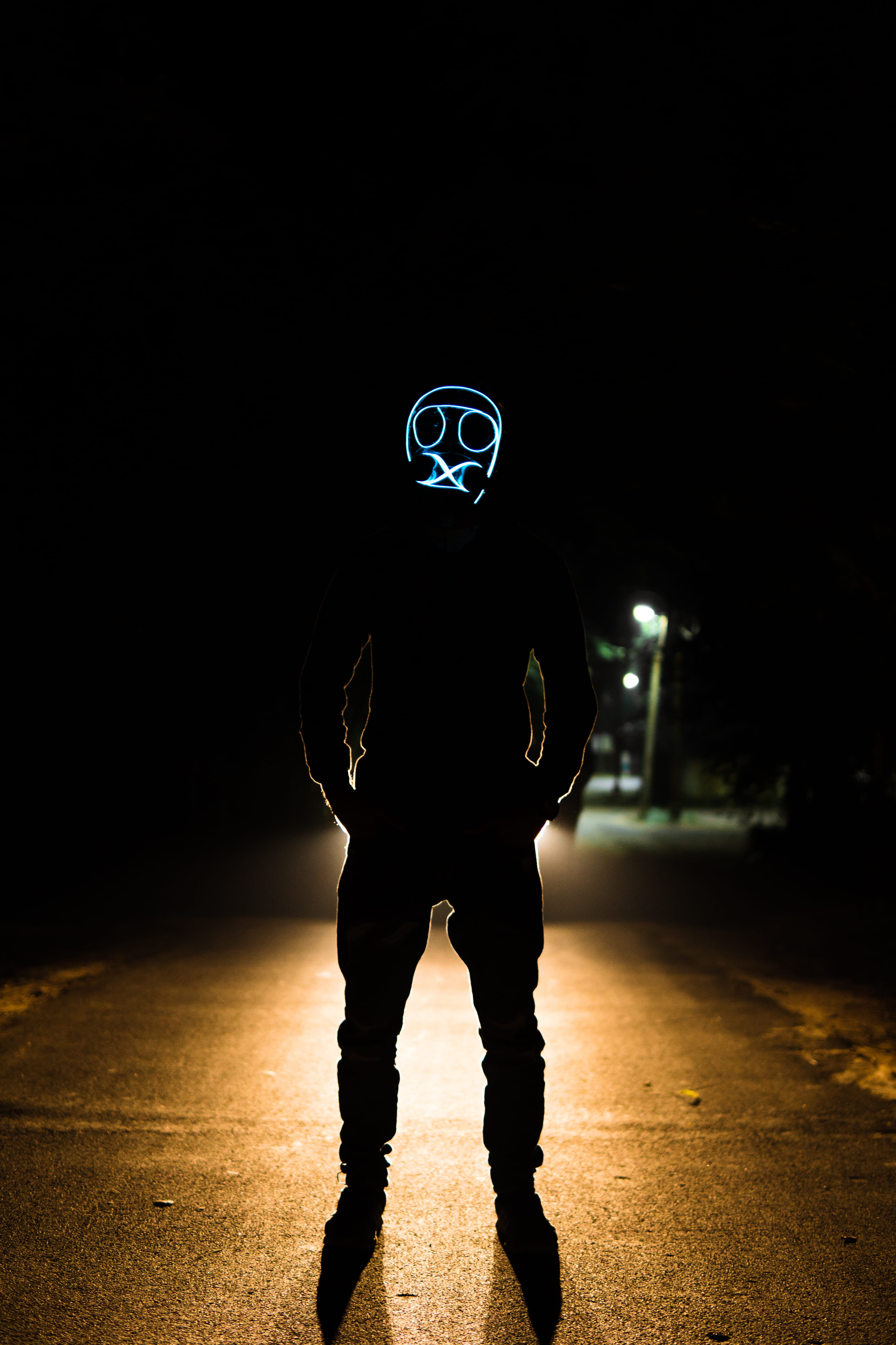 standing, disguise, casual clothing, lighting, person, dark, man, illuminated, hood, pedestrian, asphalt, front view, real people, sport, human, mask, silhouette, Phone HD Wallpaper