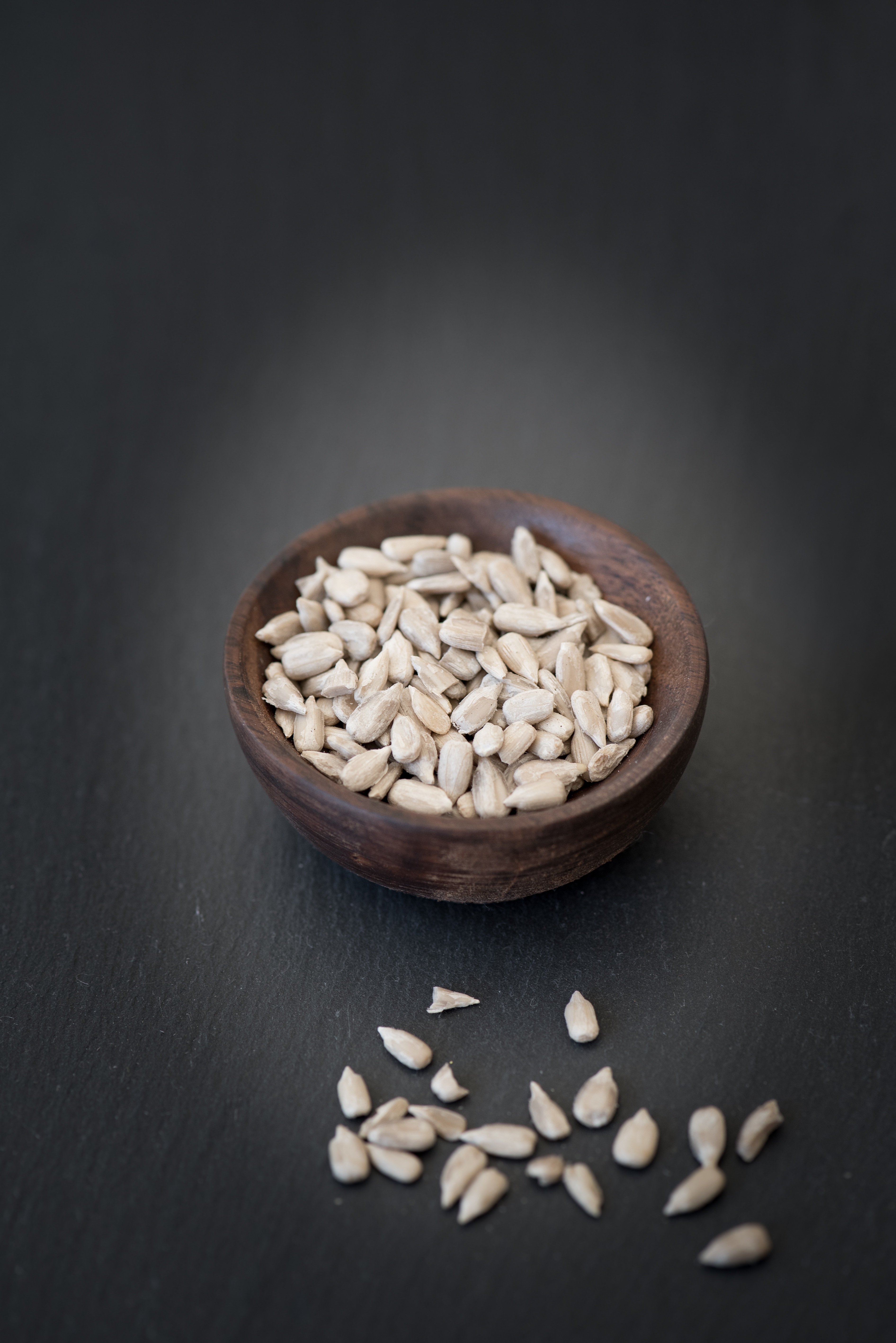sunflower seeds, black background, healthy eating, shelled sunflower seeds, food, close-up, gray background, seed, text dom, eat, cores, wellbeing, raw food, Phone HD Wallpaper