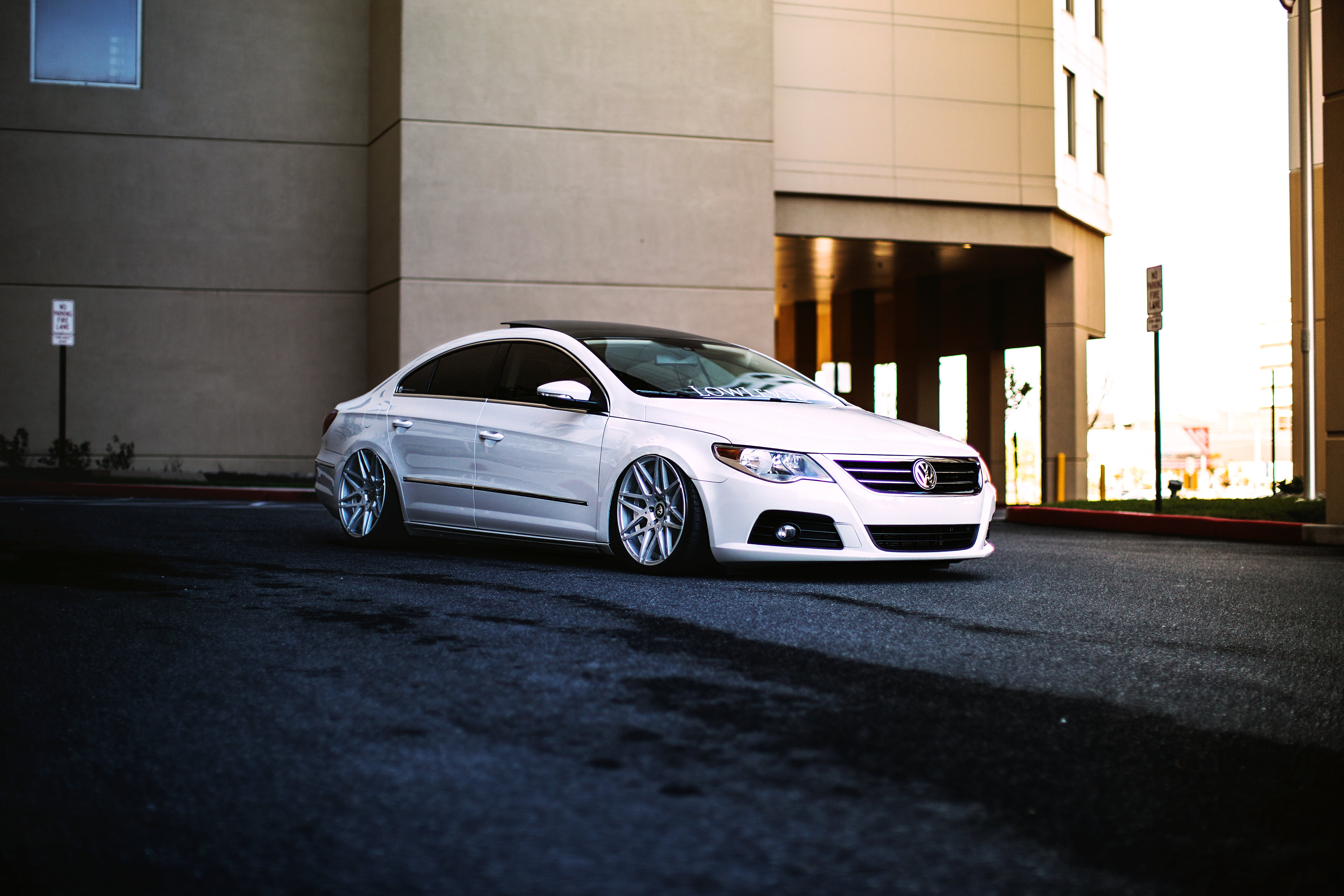 urban Scene, parking Lot, bMW, road, cc, sports Car, motion, car Dealership, hatchback, modern, transportation, 5K, architecture, Volkswagen, editorial, HD Wallpaper
