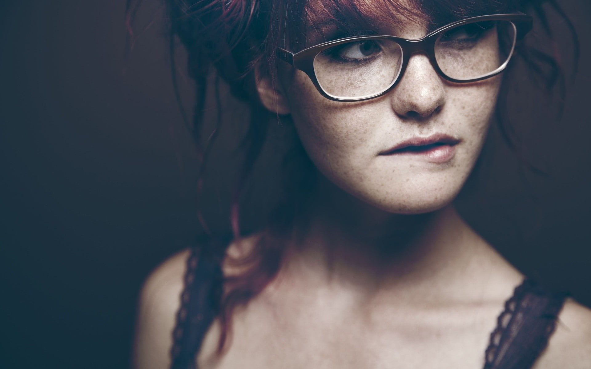 hairstyle, face, eyeglasses, close-up, depression - sadness, indoors, beautiful woman, headshot, young adult, front view, teenager, black background, biting lip, HD Wallpaper