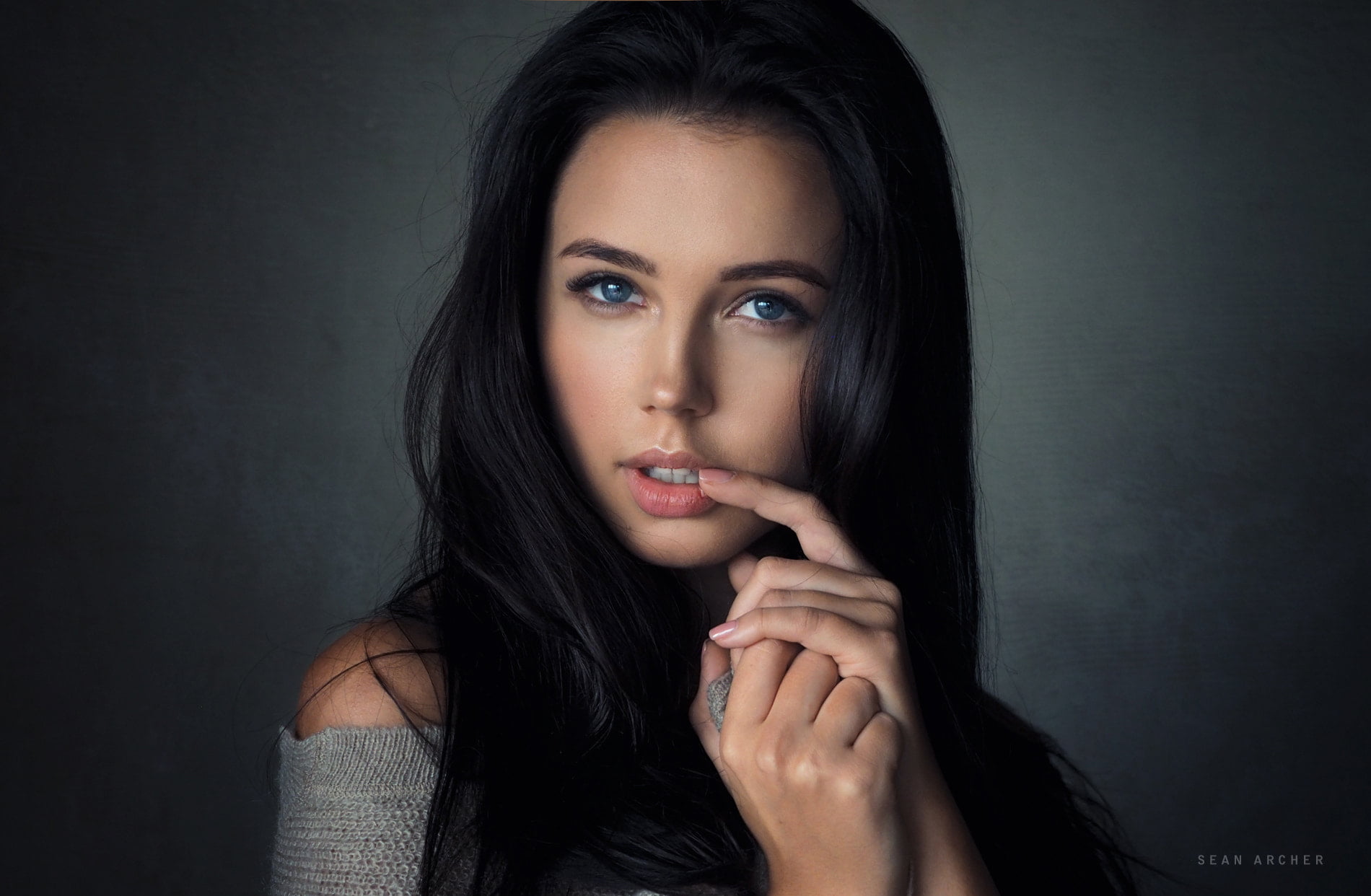 young adult, hairstyle, close-up, finger on lips, simple background, hair, looking at camera, headshot, fashion, blue eyes, beauty, black background, hand, HD Wallpaper