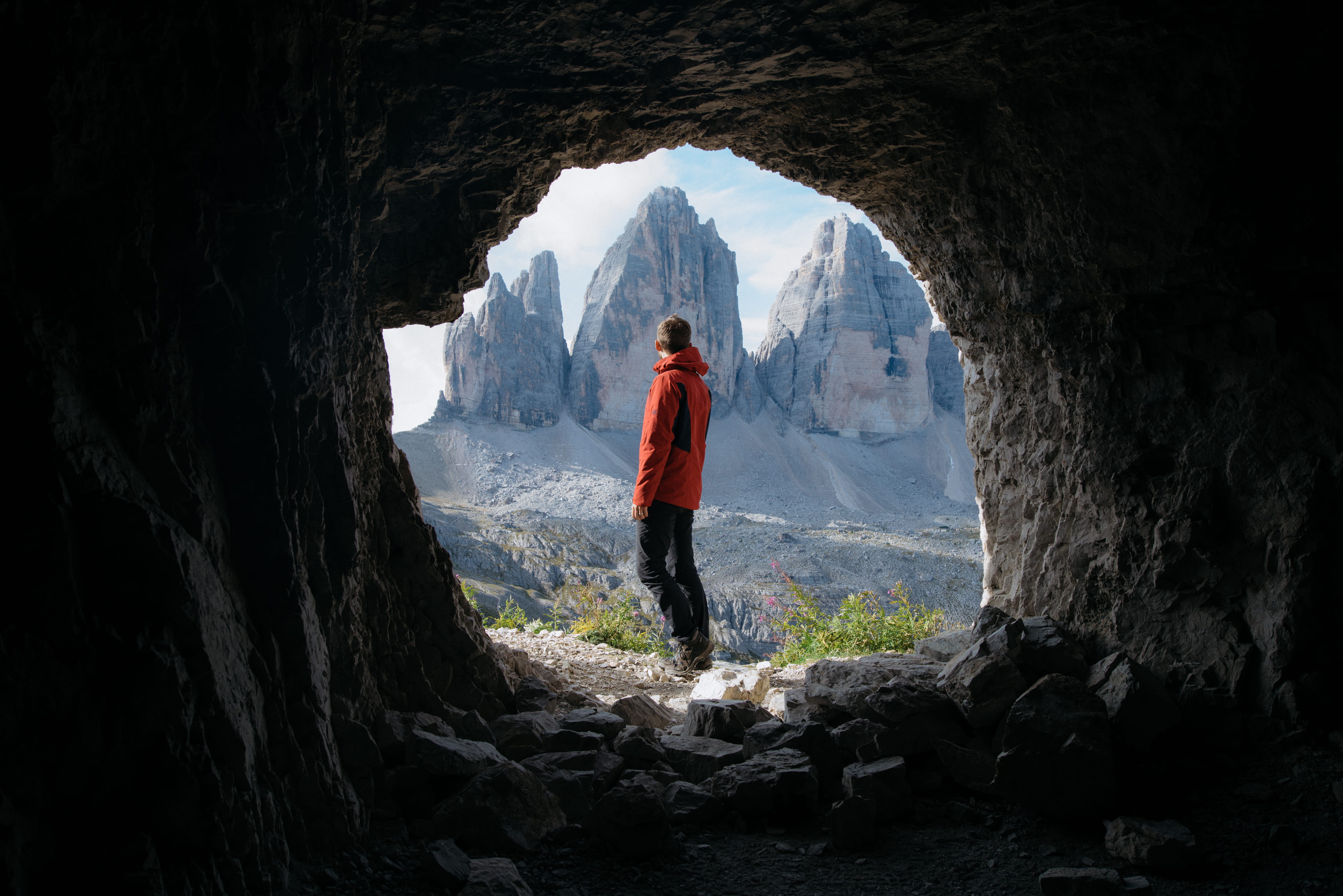 rock - object, travel, adventure, red, day, real people, scenics - nature, sky, man, hole, mountain, nature, silhouette, lifestyles, shape, framed, young adult, HD Wallpaper