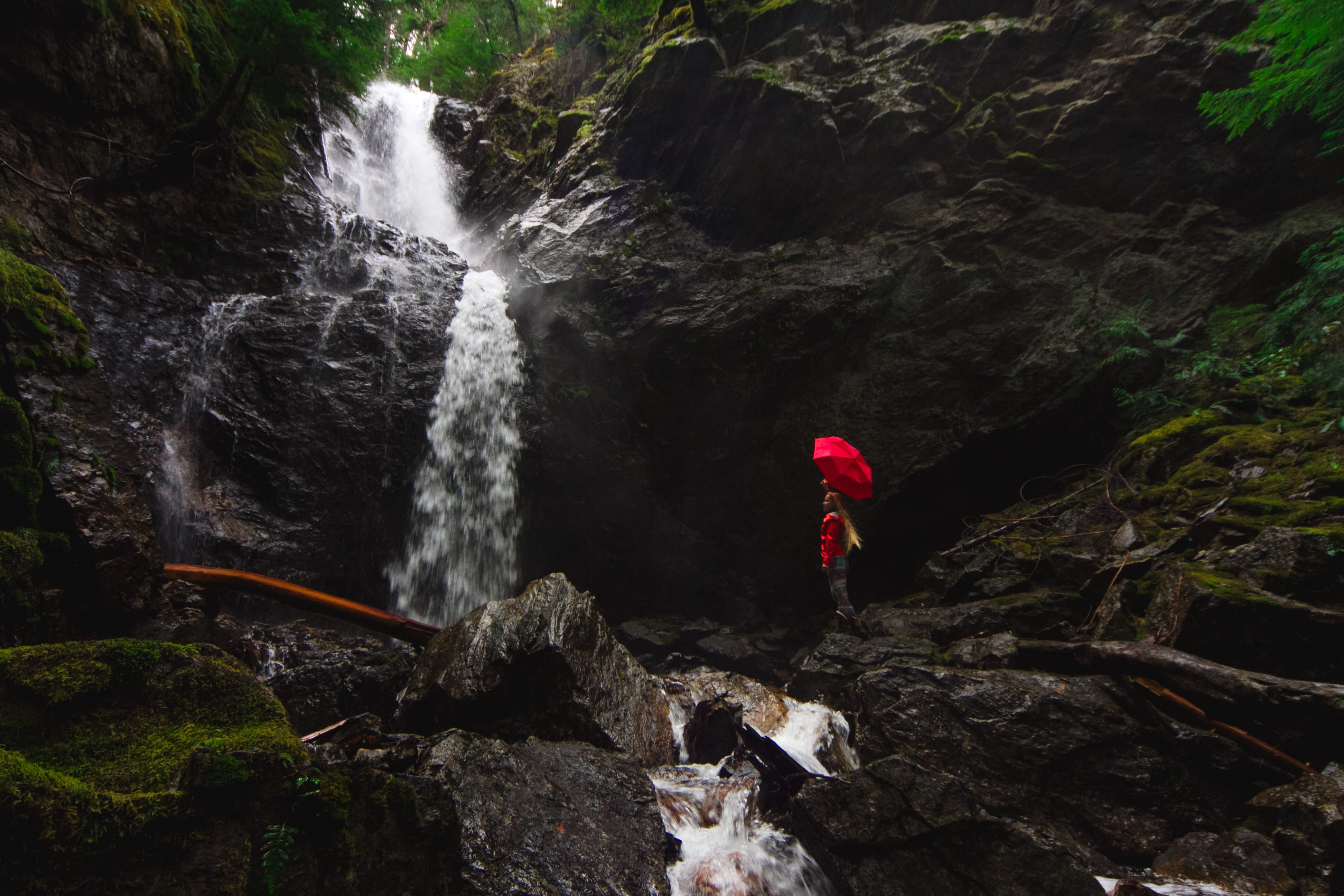 nature, red, forest, stream, solid, rock - Object, waterfall, flowing water, near, person, landscape, rock, girl, red umbrella, motion, 4K, falls, river, HD Wallpaper
