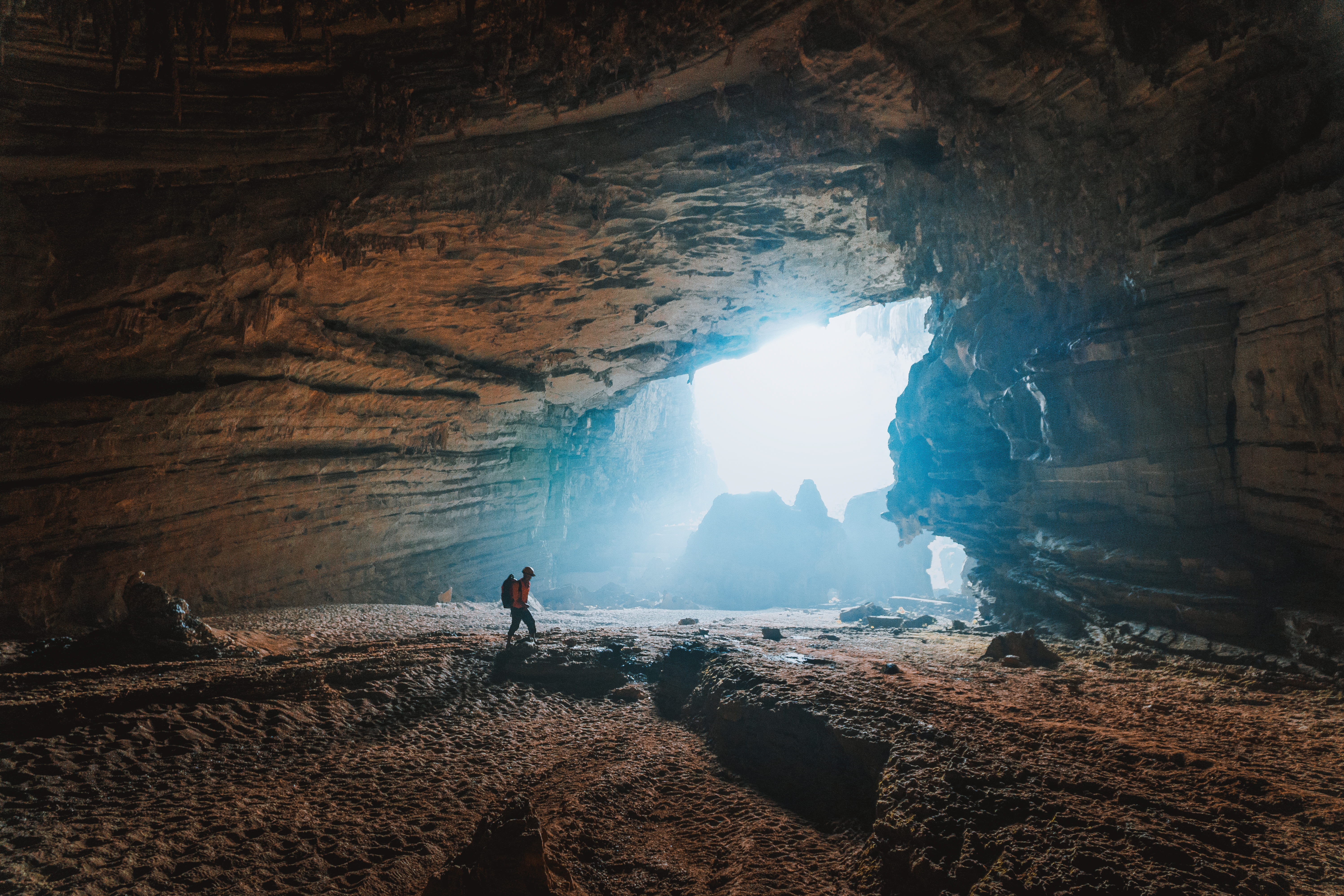 real people, brown, rock, explore cafe, light, opening, nature, indoors, cave, full length, men, beauty in nature, solid, adventure, blue, towards, leisure activity, HD Wallpaper