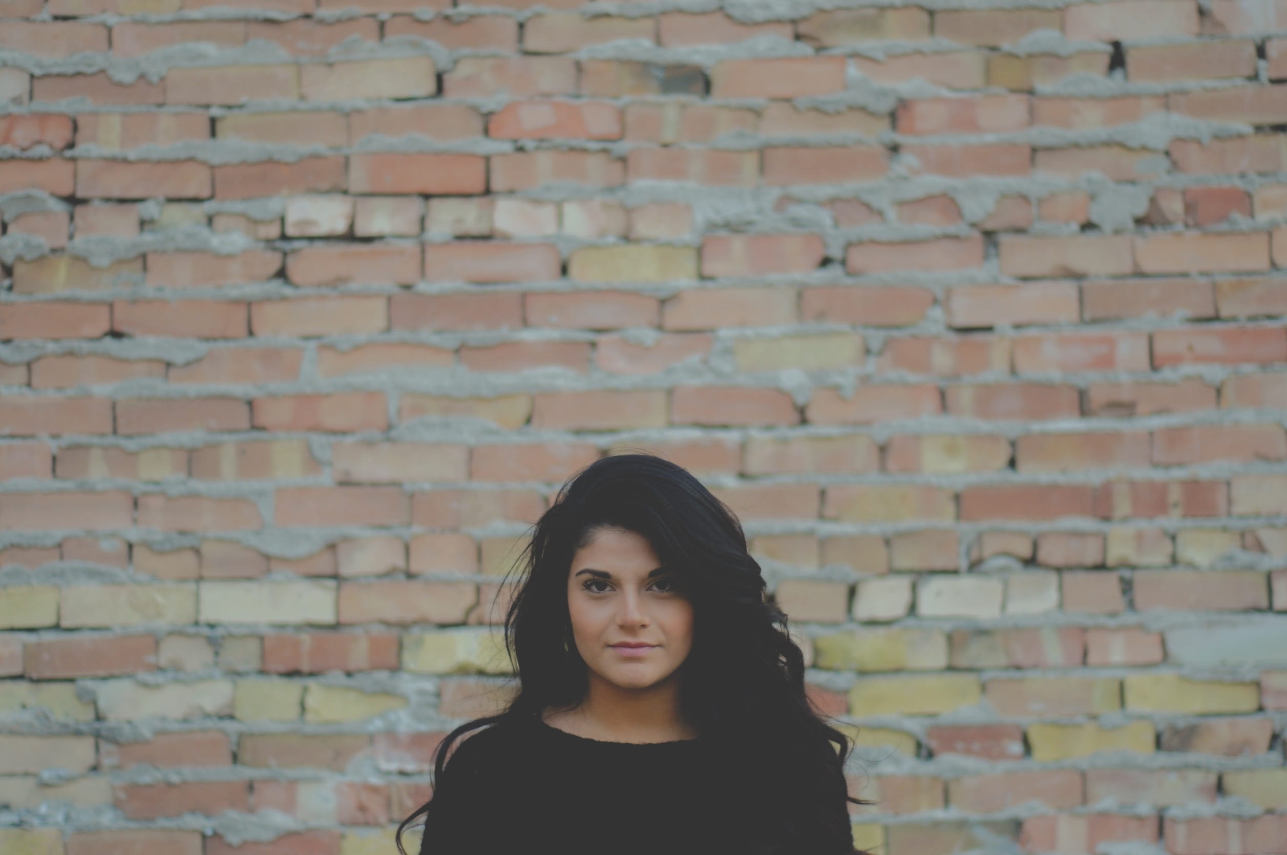 hair, brick wall, contemplation, face, people, bricks, lifestyles, portrait, bricked, model, cute, hairstyle, women, young, beautiful, brown, makeup, wears, HD Wallpaper