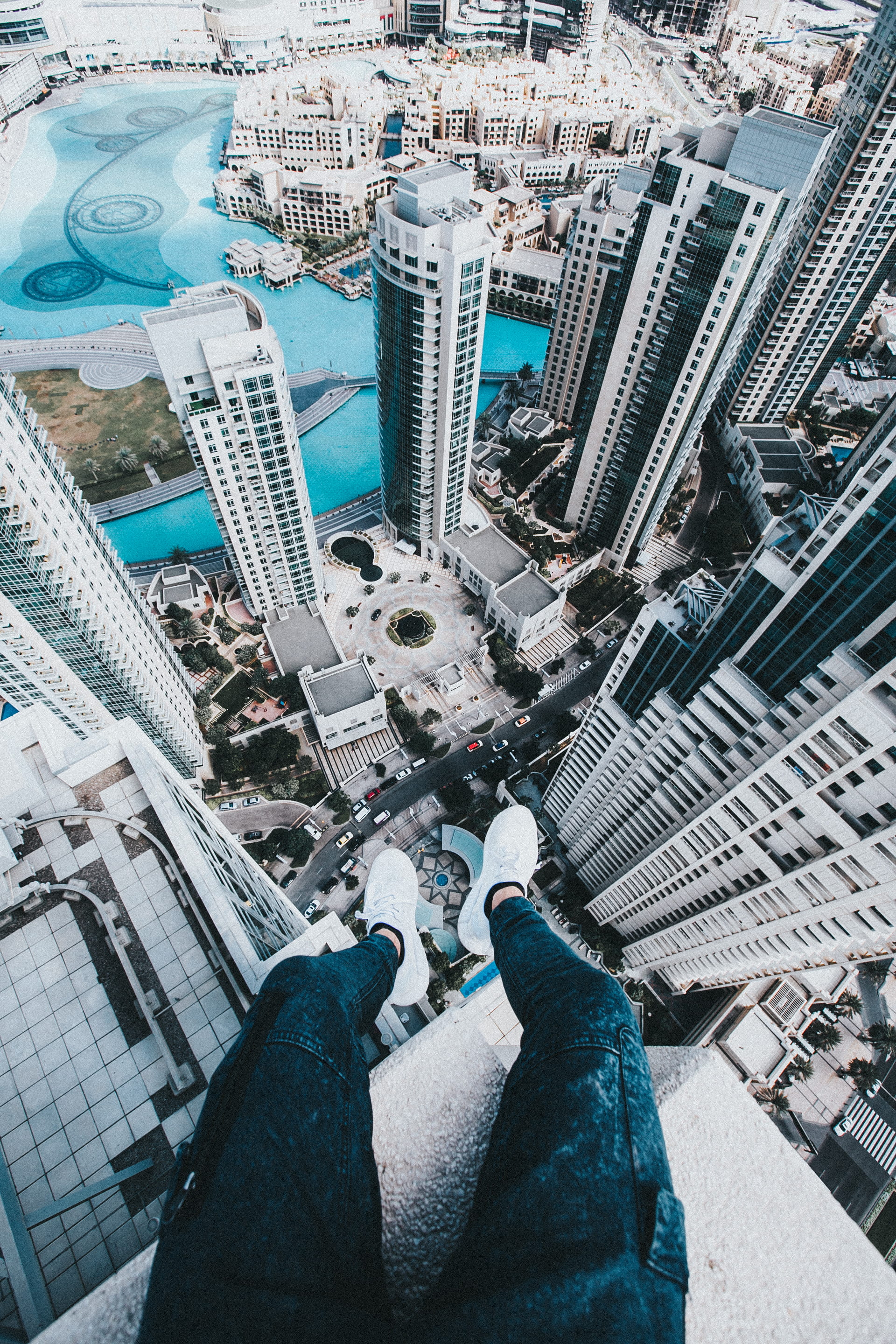 men, architecture, skyline, eye, financial district, sky, rooftop, high angle view, 2K, personal perspective, water, jeans, office building exterior, roofing, Phone HD Wallpaper