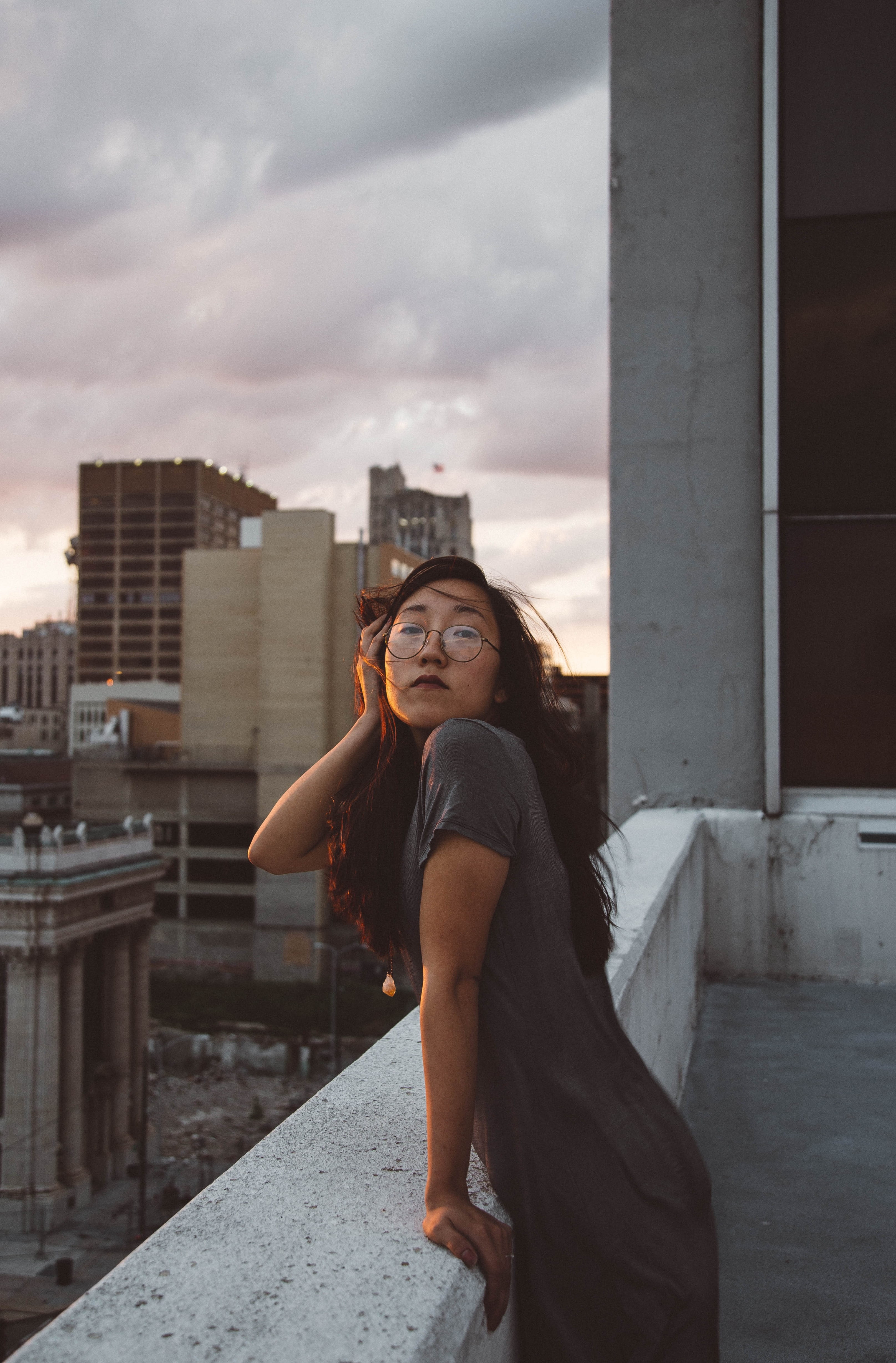front view, nature, balcony, cloud - sky, standing, asian, outdoors, real people, leaning, city, beautiful woman, looking at camera, young adult, office building exterior, Phone HD Wallpaper