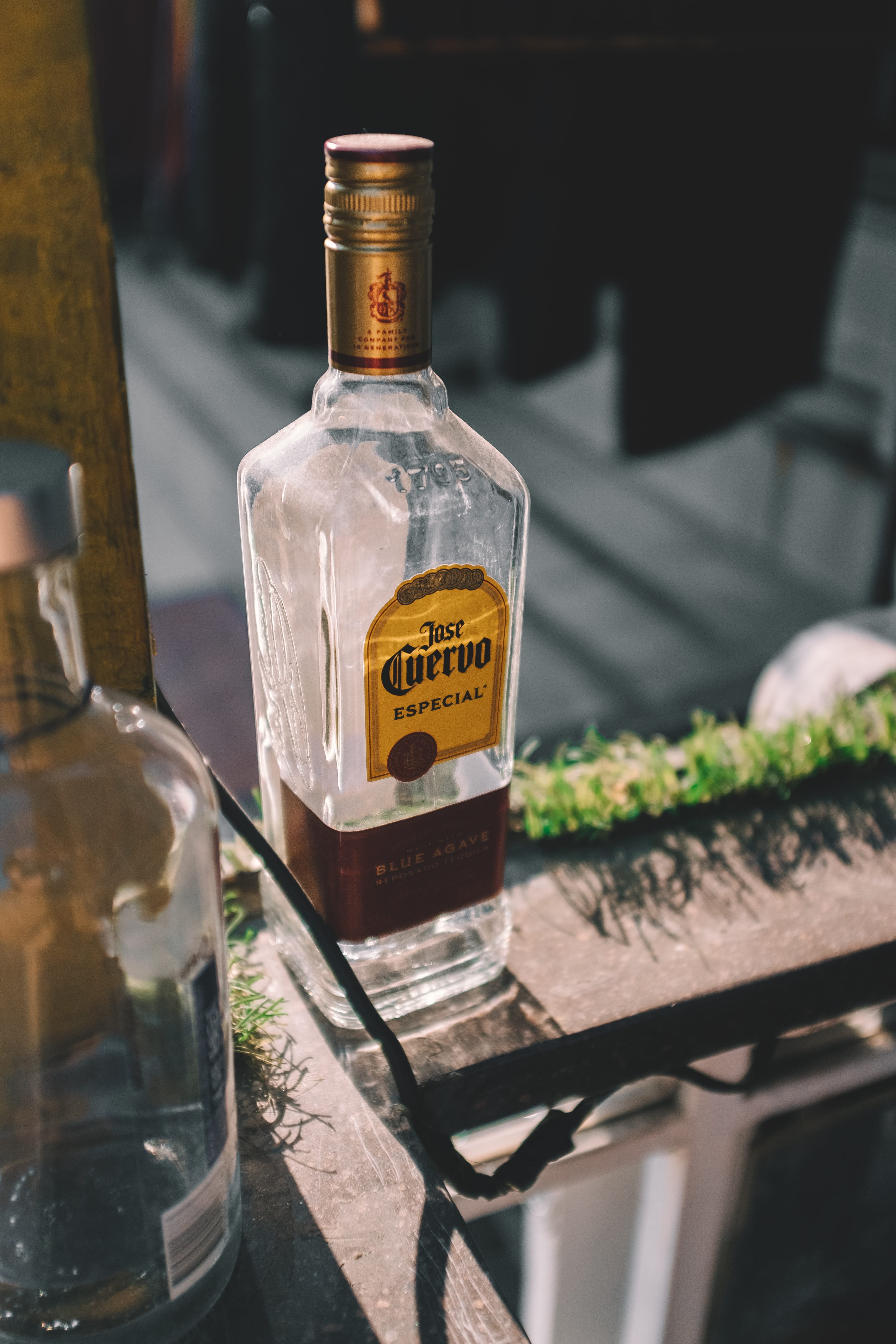 drink, outdoors, label, empty, architecture, oil, container, transparent, alcohol, building, plant, 4K, spire, cocktail, text, glass, city, town, cuervo, Phone HD Wallpaper