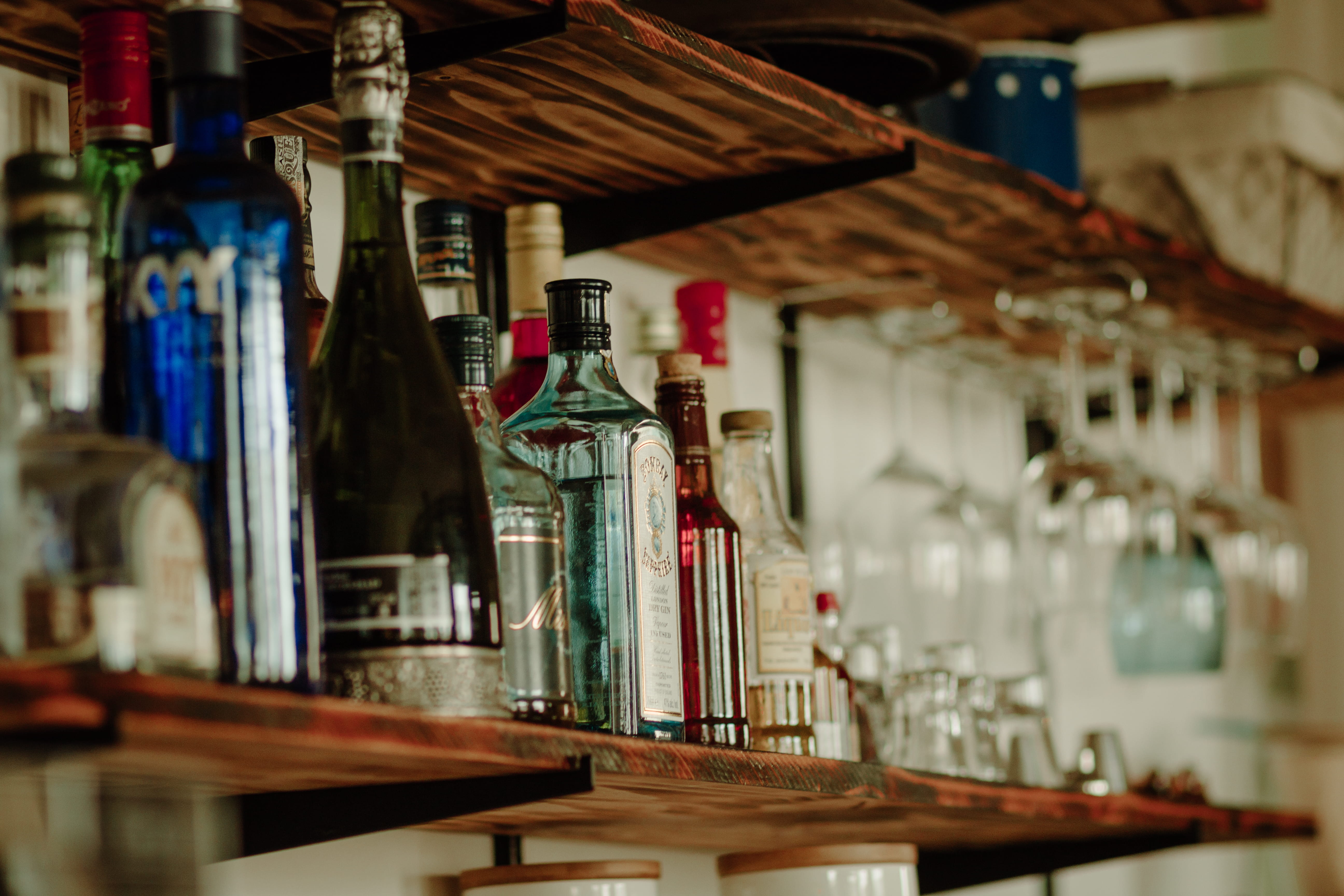 no people, bar, still life, liquor, vodka, selective focus, shelf, glass - material, table, stock, retail, food and drink, pub, container, 5K, alcoholic beverages, HD Wallpaper