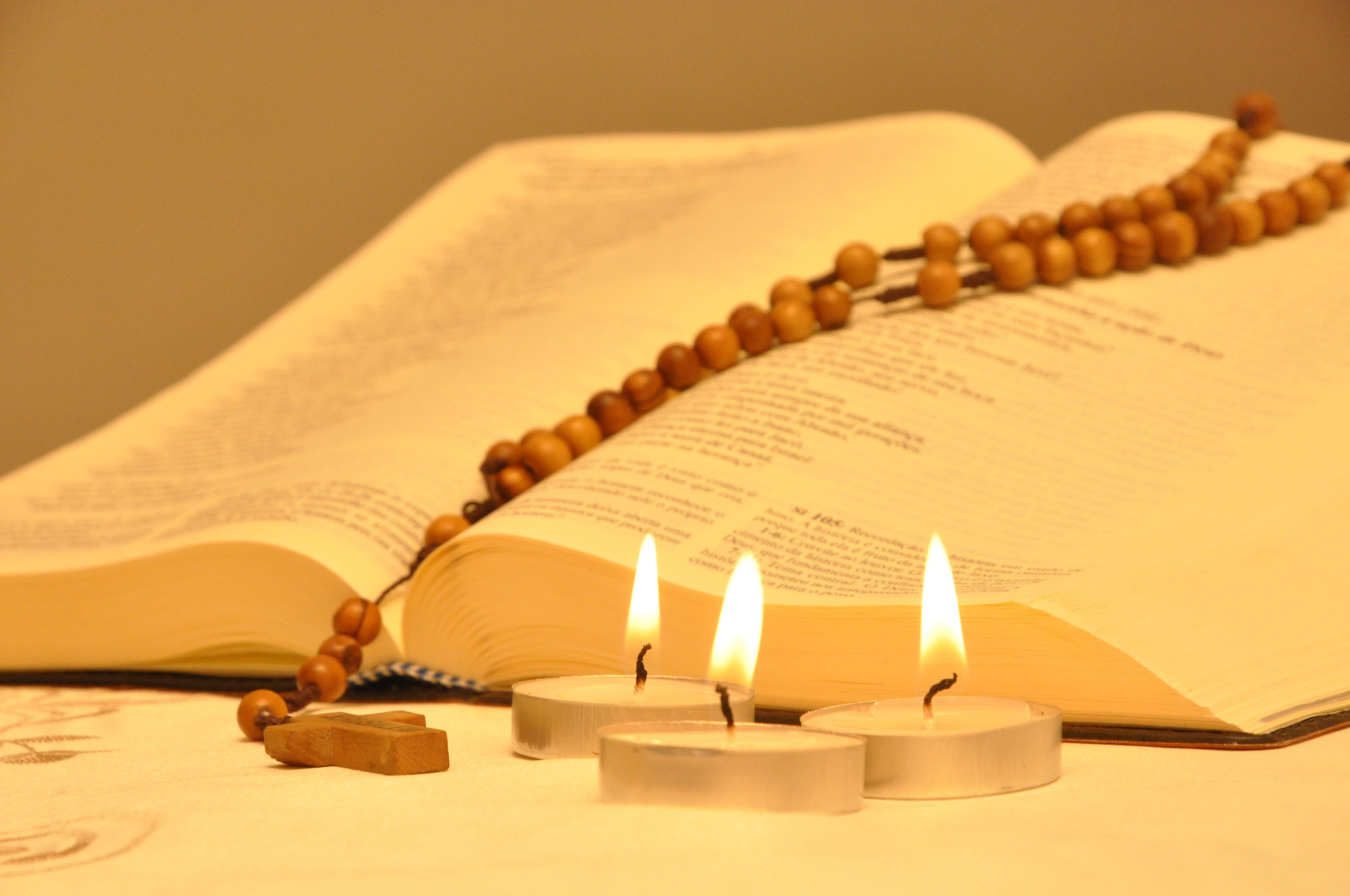 selective focus, illuminated, still life, tealight, 4K, catholicism, group of objects, flame, lit, open, close-up, third, sand, religion, no people, heat - temperature, HD Wallpaper