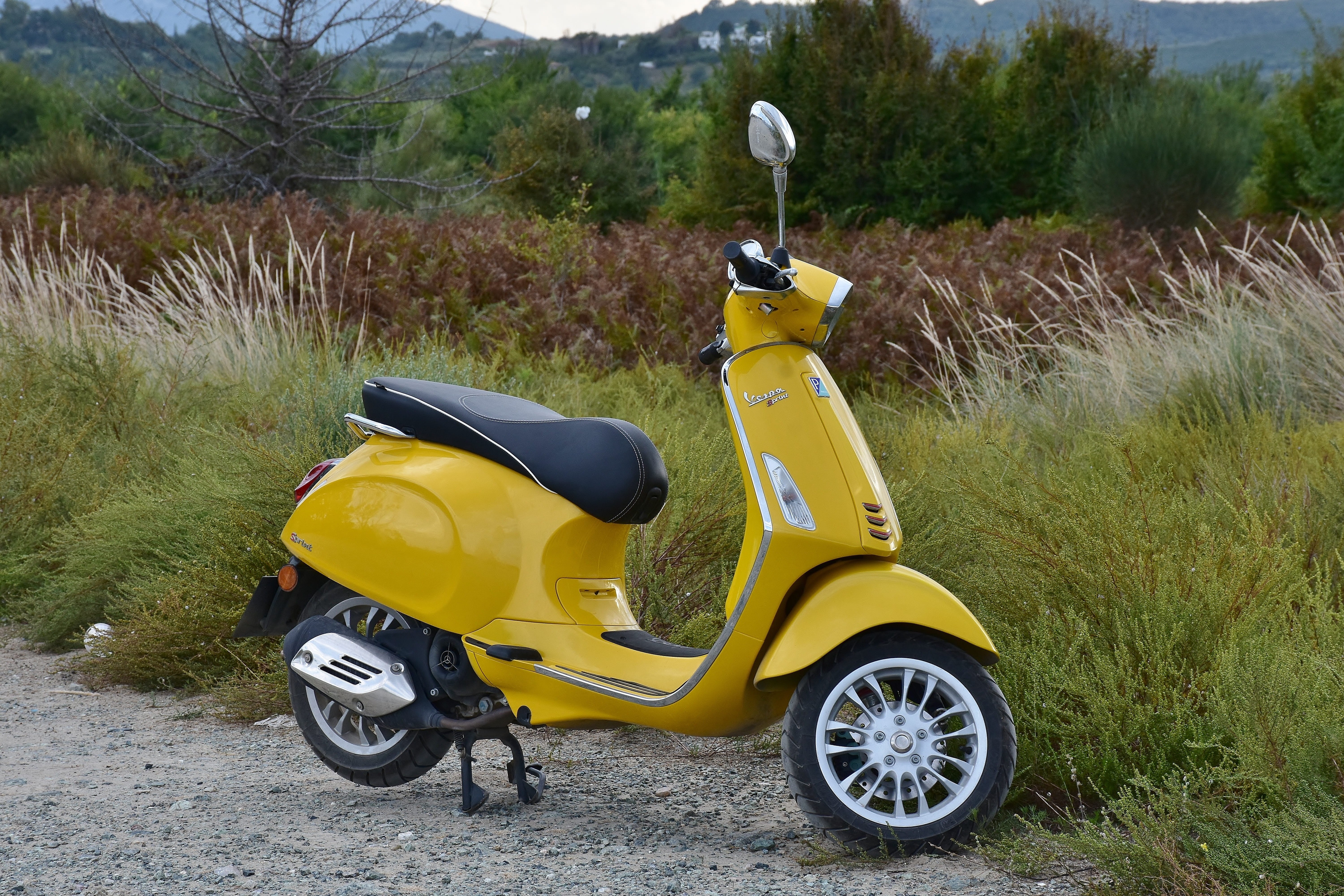 land vehicle, outdoors, field, yellow, vehicle, city, parking, motor scooter, mode of transportation, no people, nature, street, drive, road, grass, scooter, HD Wallpaper