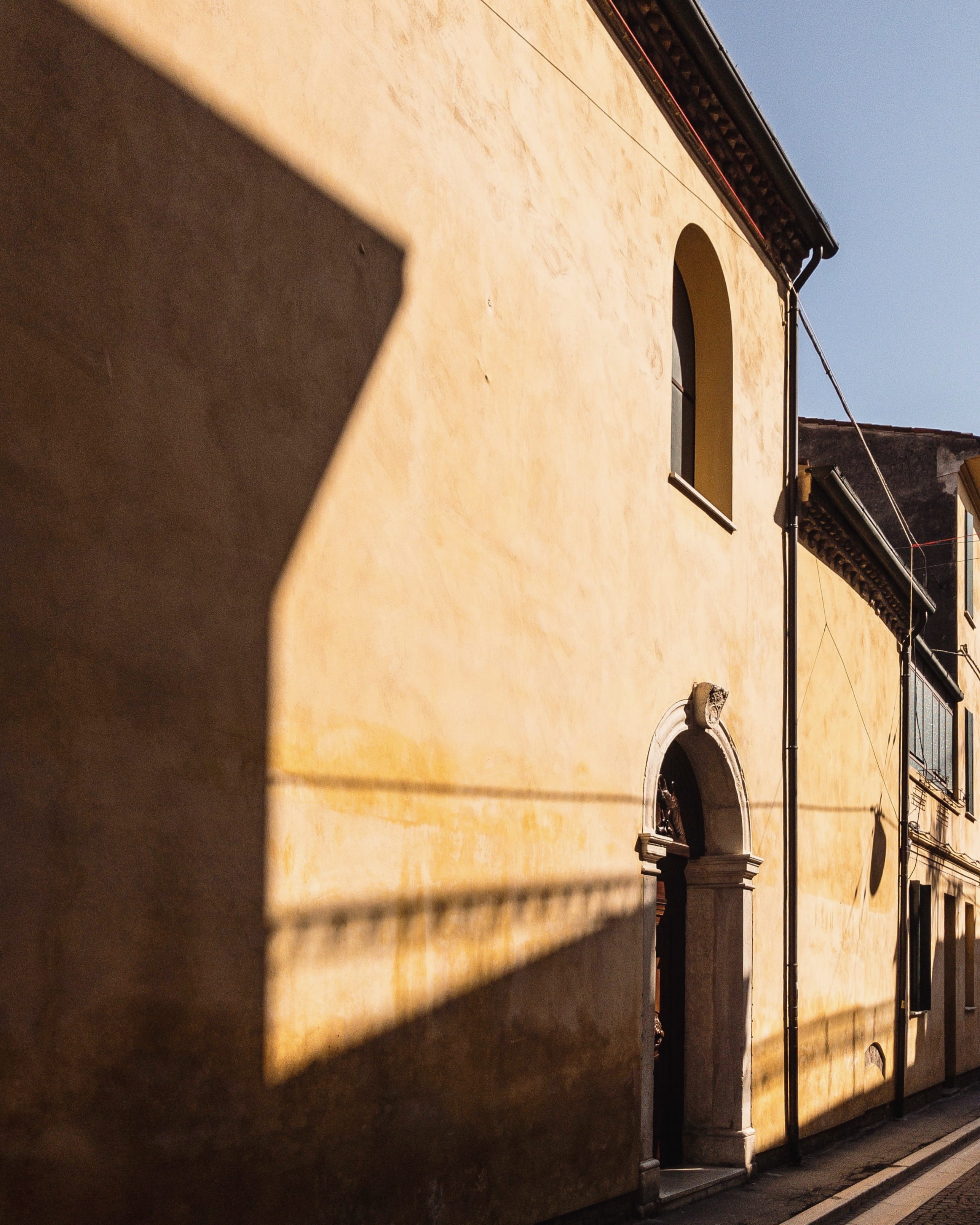 door, light, concrete, yellow, brick, arch, day, brown, dark, sunlight, built structure, electric lamp, geometry, italy, 2K, spring, place of worship, Phone HD Wallpaper