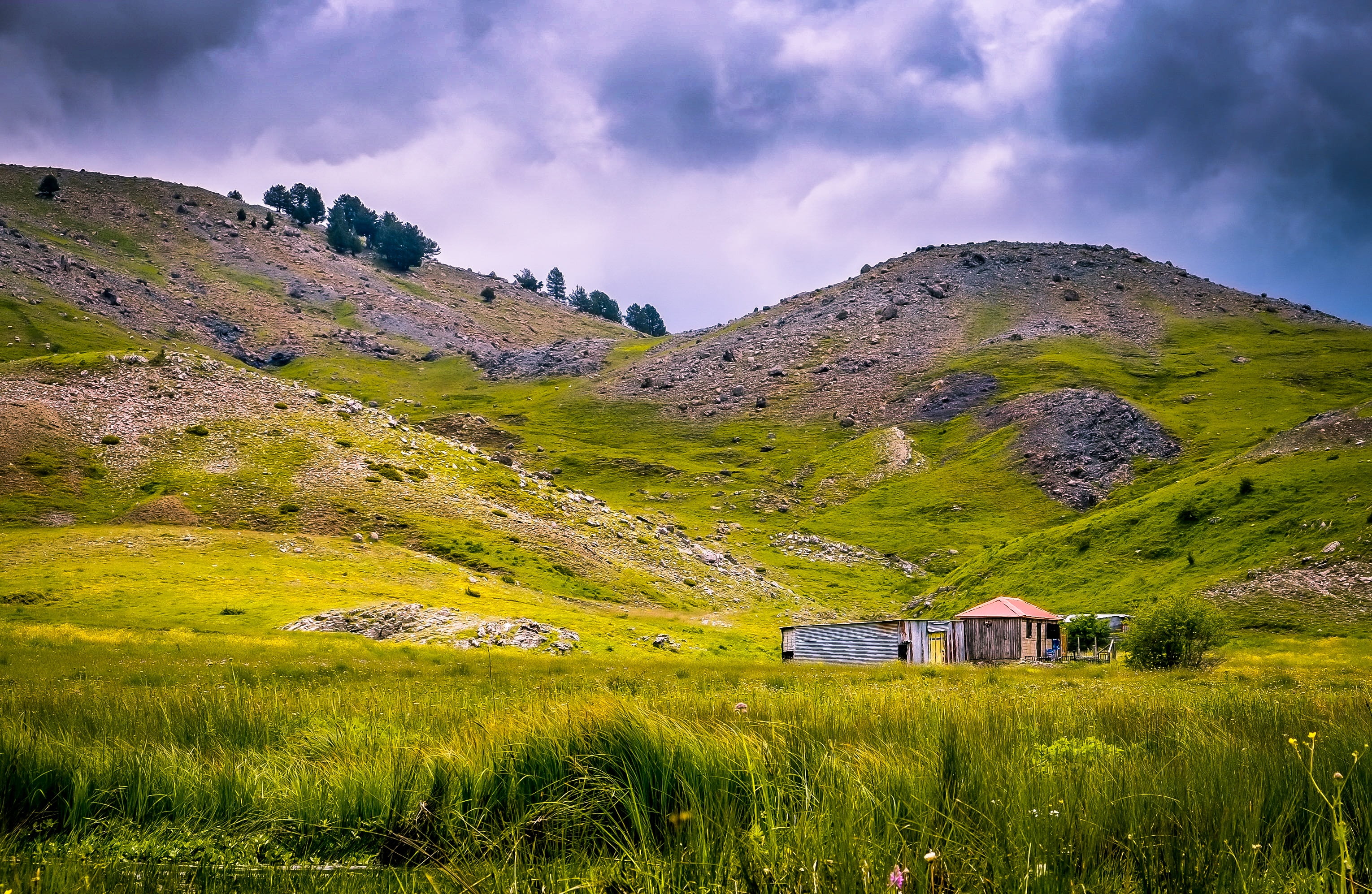 building, non-urban scene, plain, nature, cottage, plant, environment, mountain range, architecture, house, outdoors, cloud - sky, field, travel destinations, HD Wallpaper