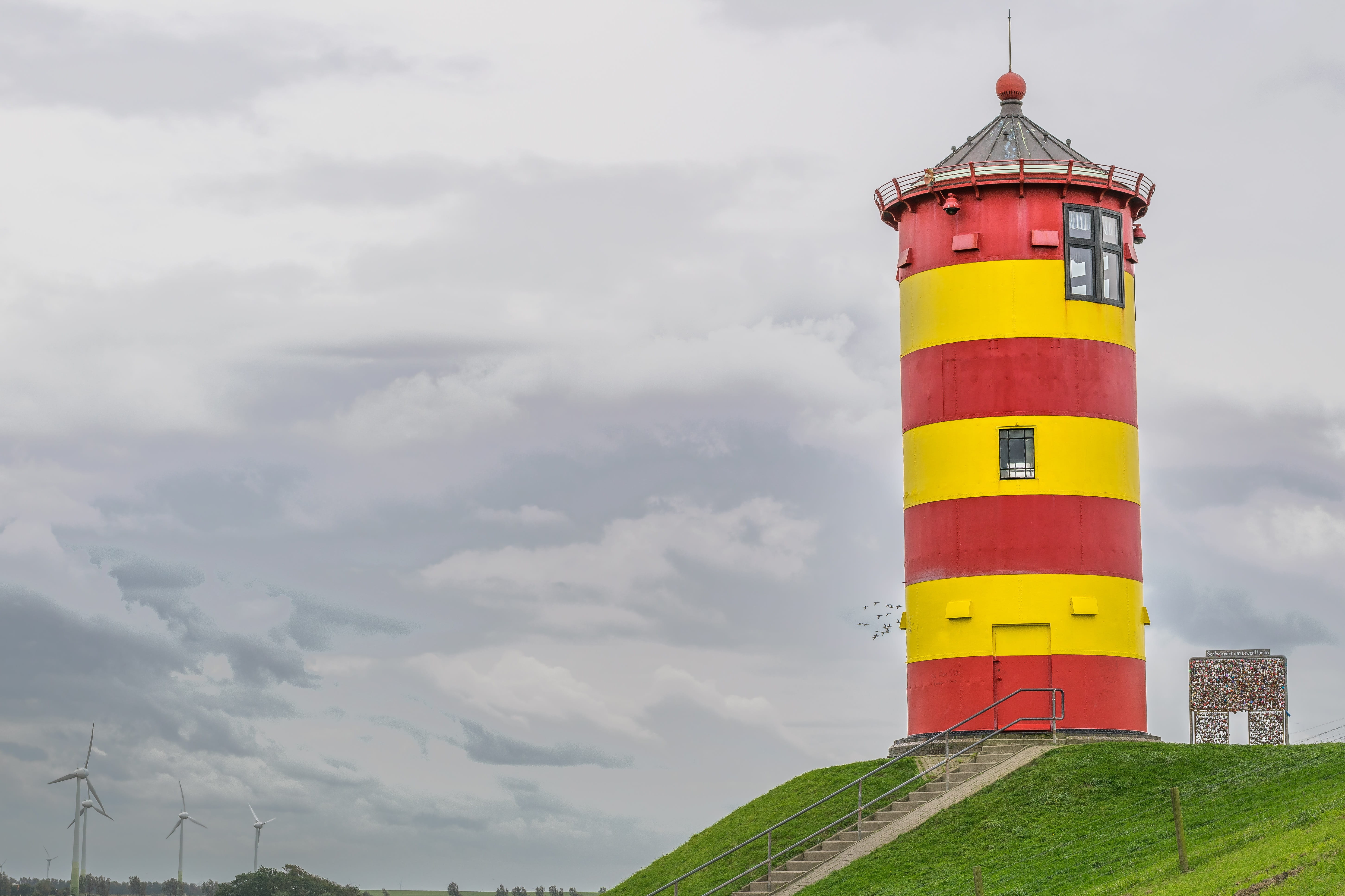 building exterior, tall - high, places of interest, 5K, sky, north sea, building, red, built structure, no people, security, outdoors, landscape, water, HD Wallpaper