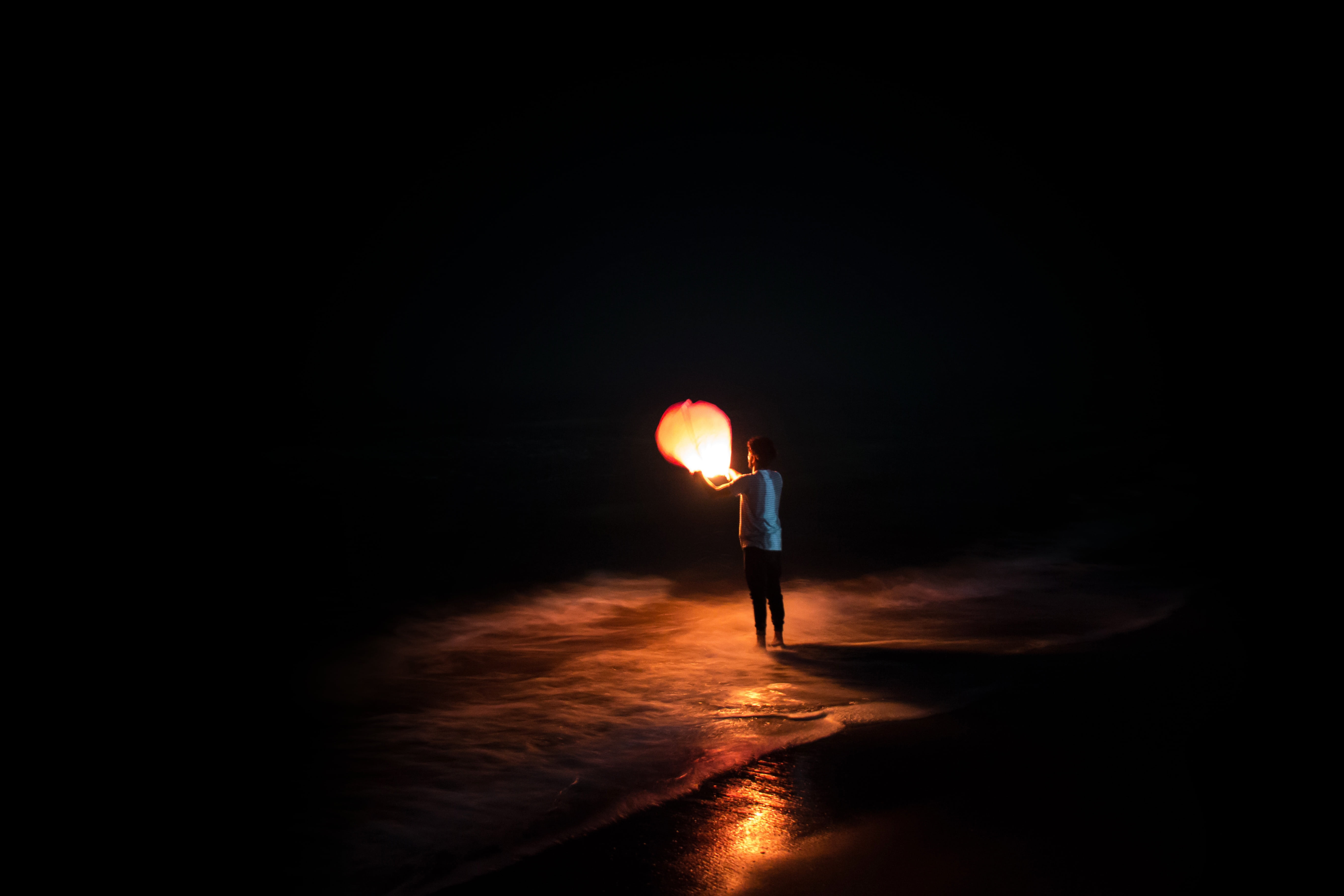 man, beach, copy space, person, holding, paper, one man only, illuminated, night, mystery, one person, glowing, standing, ocean, men, water, adult, balloon, HD Wallpaper