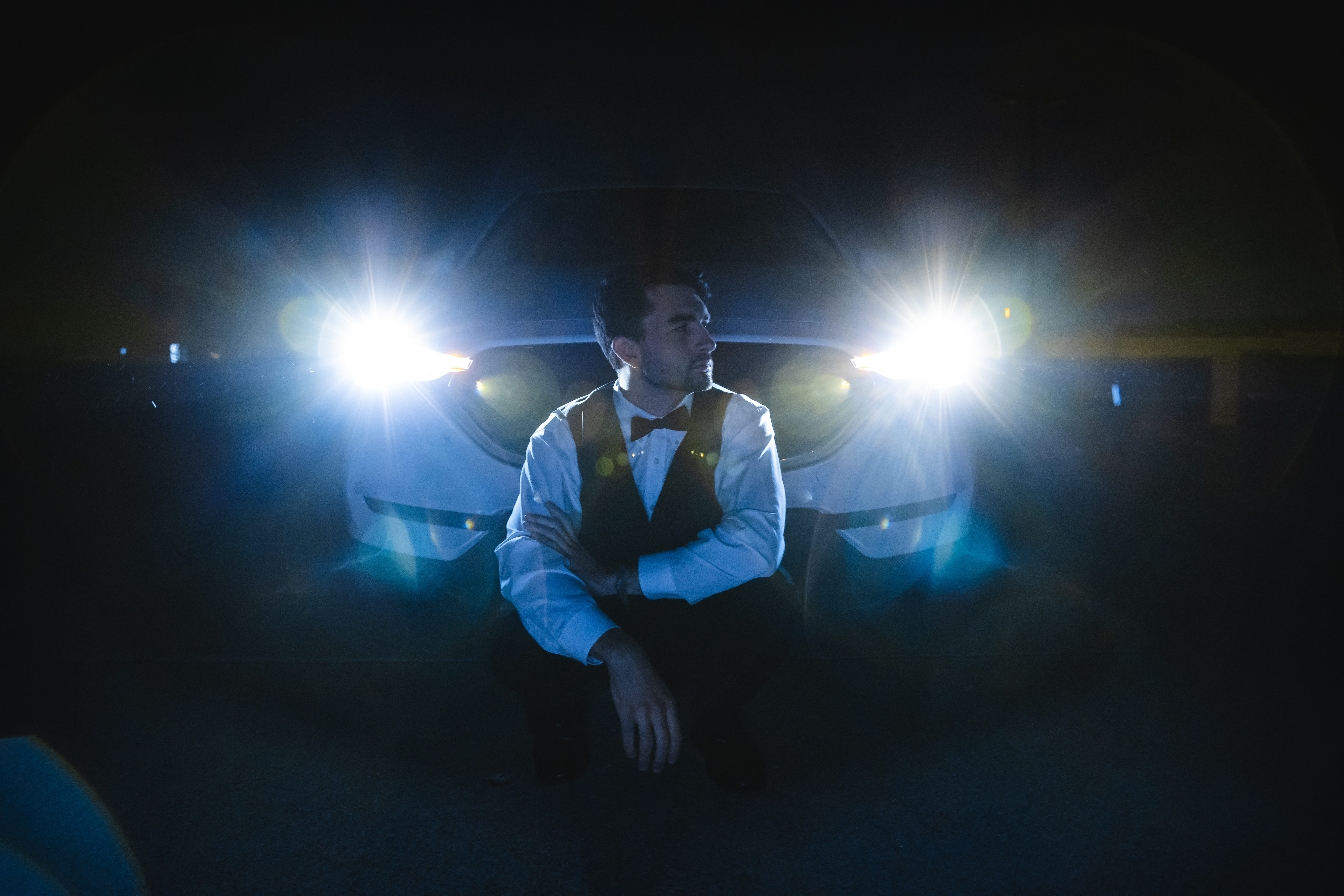 white, illuminated, one person, spotlight, car, night, guy, full length, men, standing, flare, arts culture and entertainment, stage, waist up, back, looking, HD Wallpaper