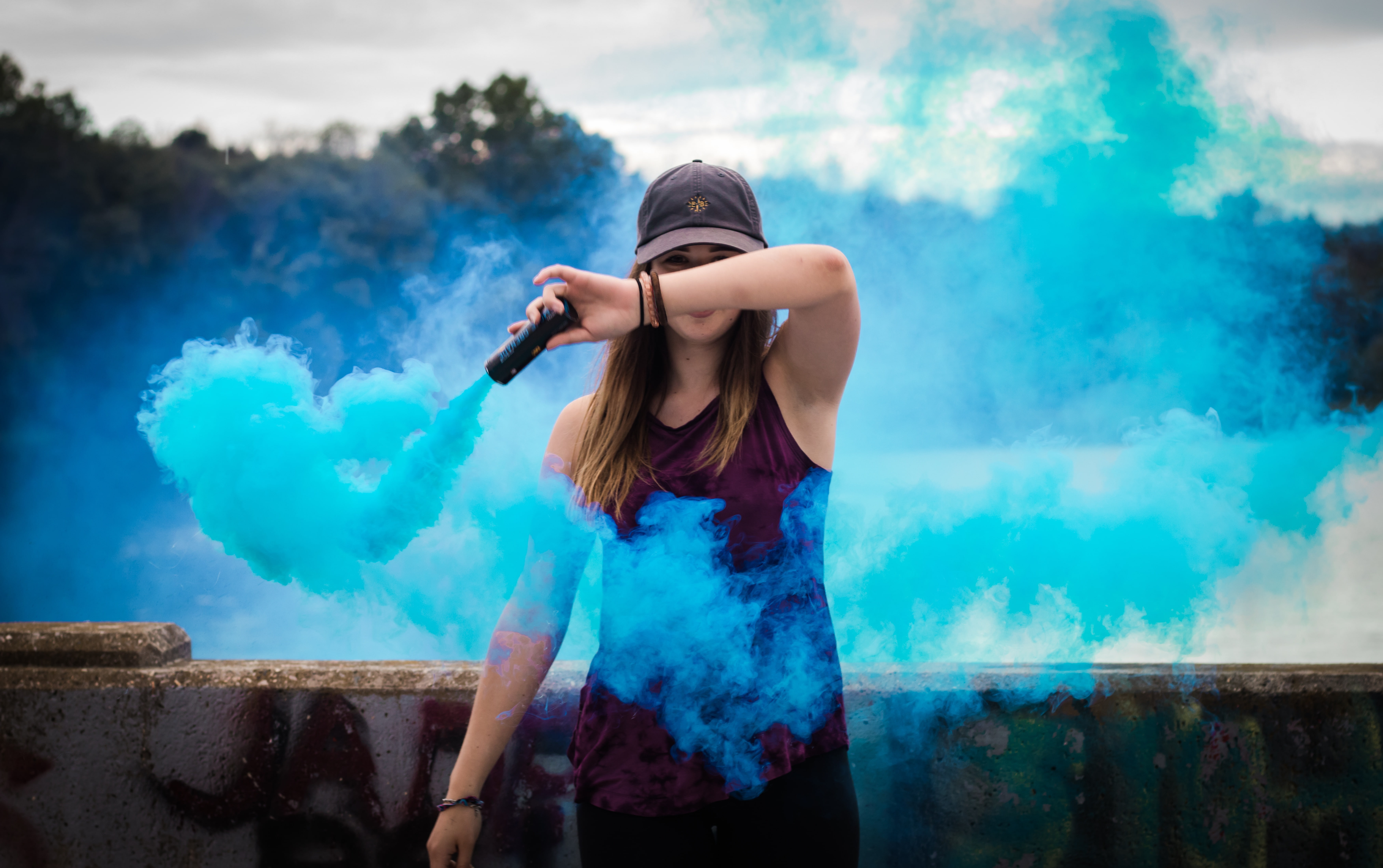bare shoulders, armpits, looking at viewer, 5K, brunette, wall, blue smoke, women outdoors, tank top, model, hat, trees, women, long hair, HD Wallpaper