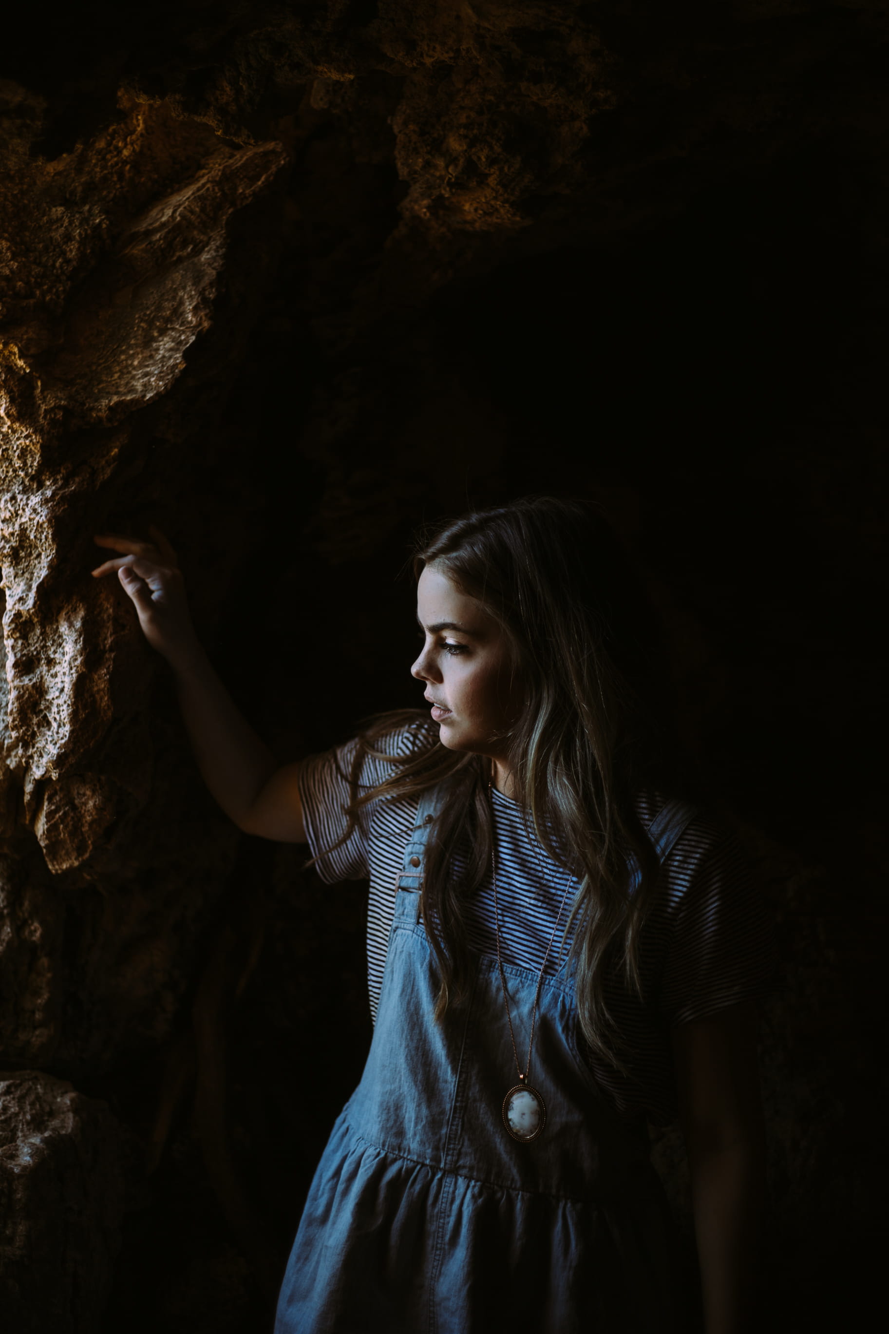 adults only, cave, rocks, human arm, women, casual clothing, 2K, inside, blue, girl, people, adult, wearing, young women, only women, striped, looking, Phone HD Wallpaper