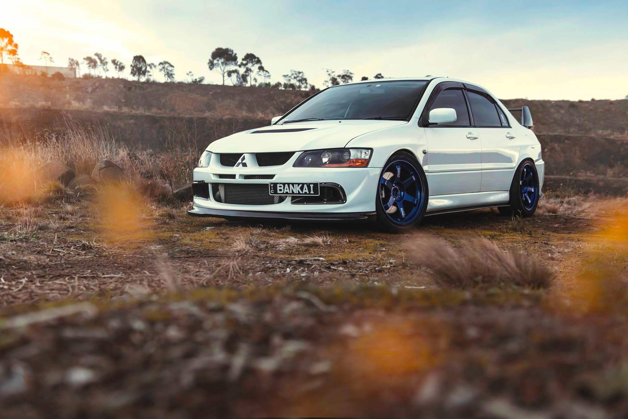 outdoors, mode of transportation, environment, land Vehicle, Lancer, Front, engine, hatchback, Mitsubishi, headlight, street, transportation, plant, road, HD Wallpaper
