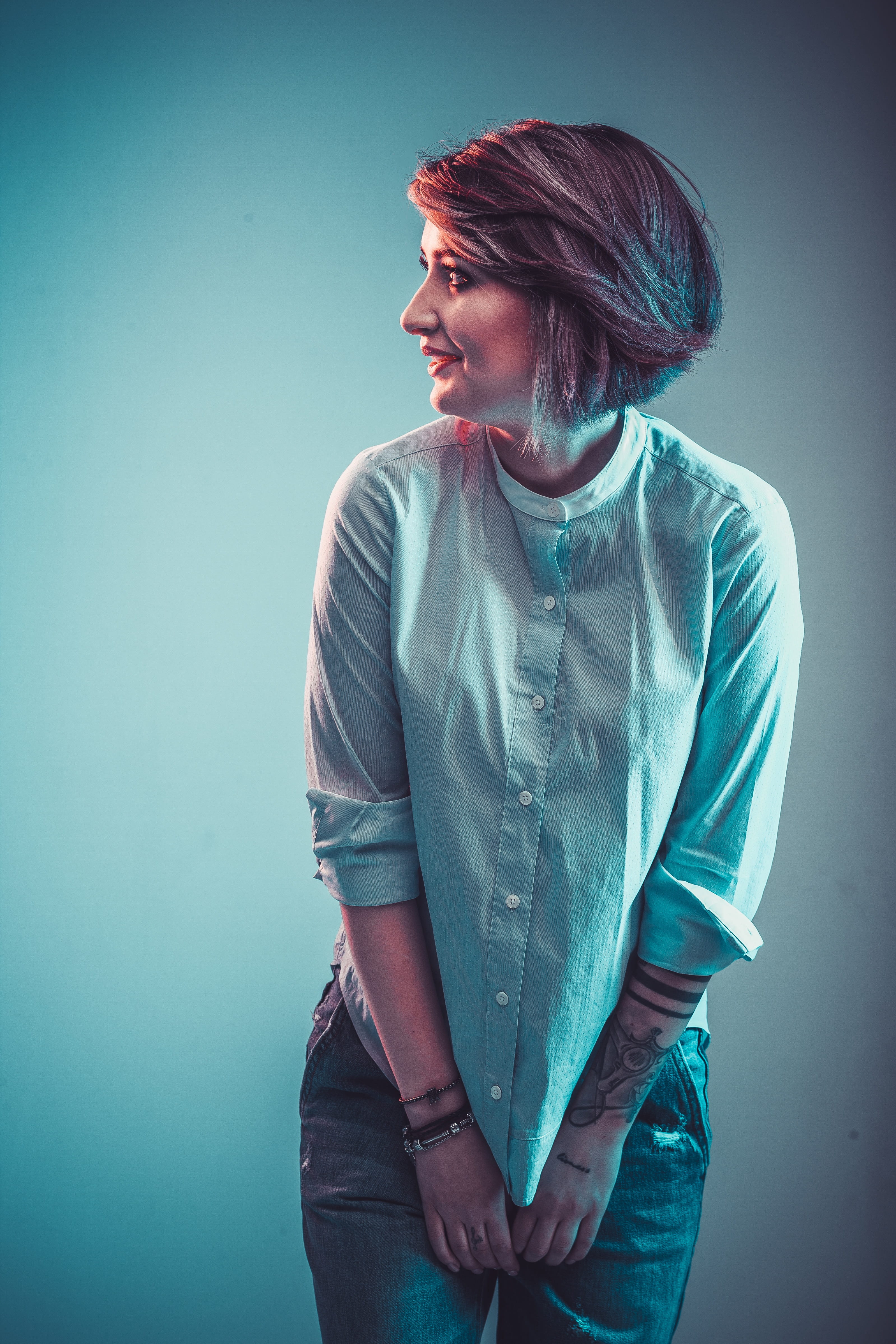 4K, studio, emotion, studio shot, white, long, young women, shirt, blue background, button, contemplation, fashion, beautiful woman, young adult, casual clothing, Phone HD Wallpaper