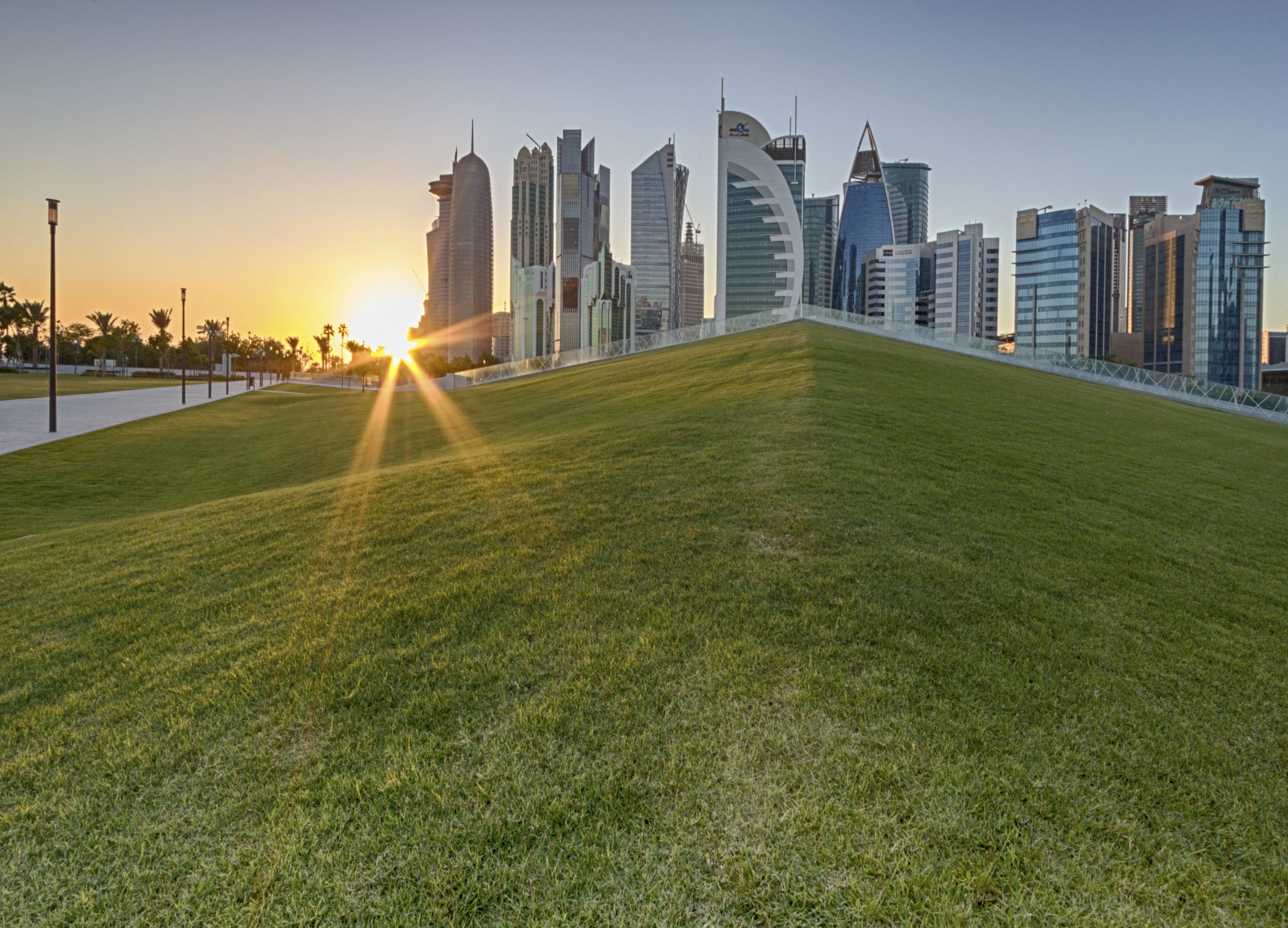 tall - high, green grass, outdoor, building, green color, architecture, park, sky, nature, outdoors, modern, plant, no people, landscape, sunset, cityscape, HD Wallpaper