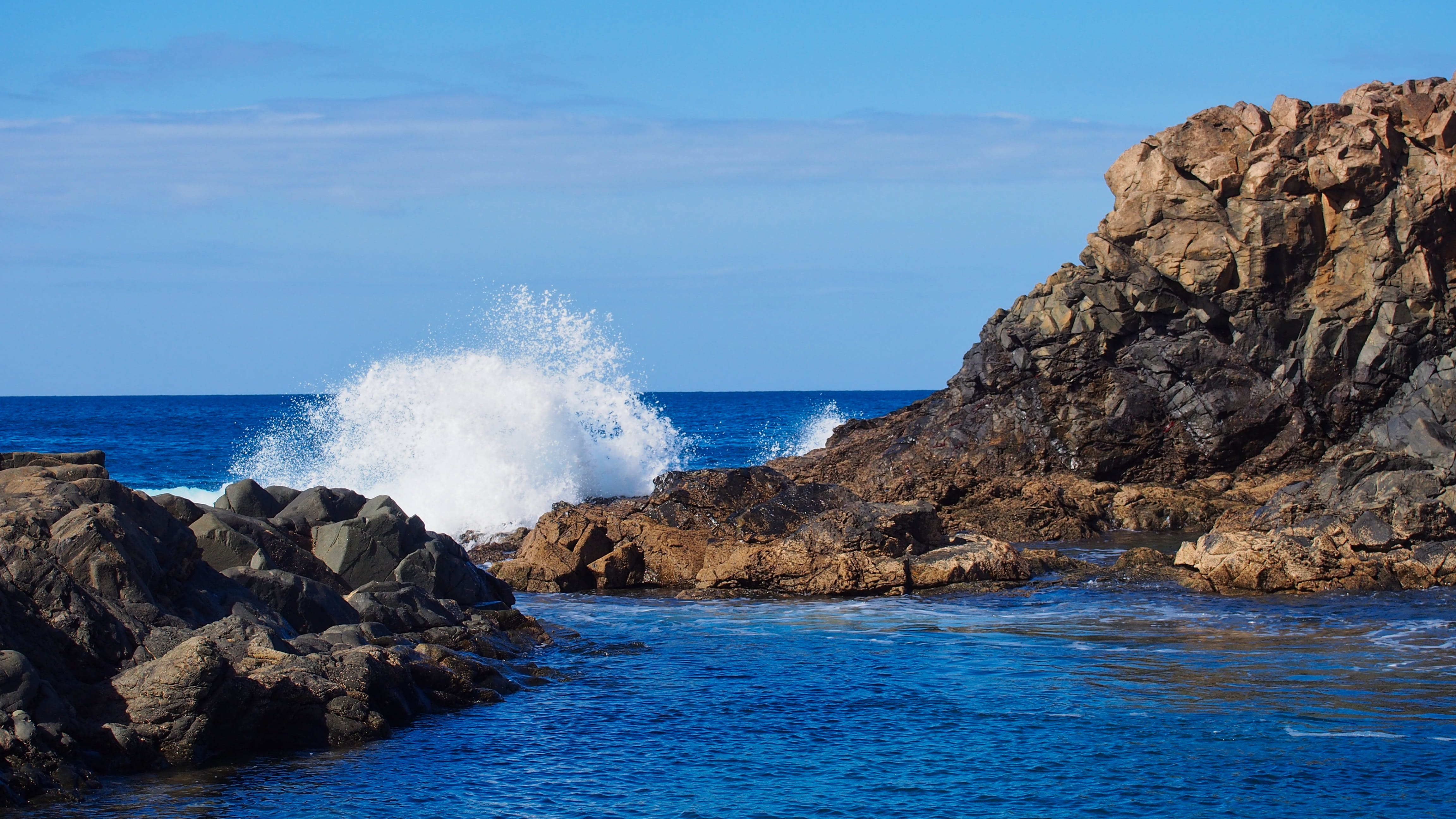 ocean, blue, coast, uninhabited, hitting, water, power in nature, vacations, 4K, summer, surf, spain, crash, rough, sky, solid, no people, rock, power, HD Wallpaper