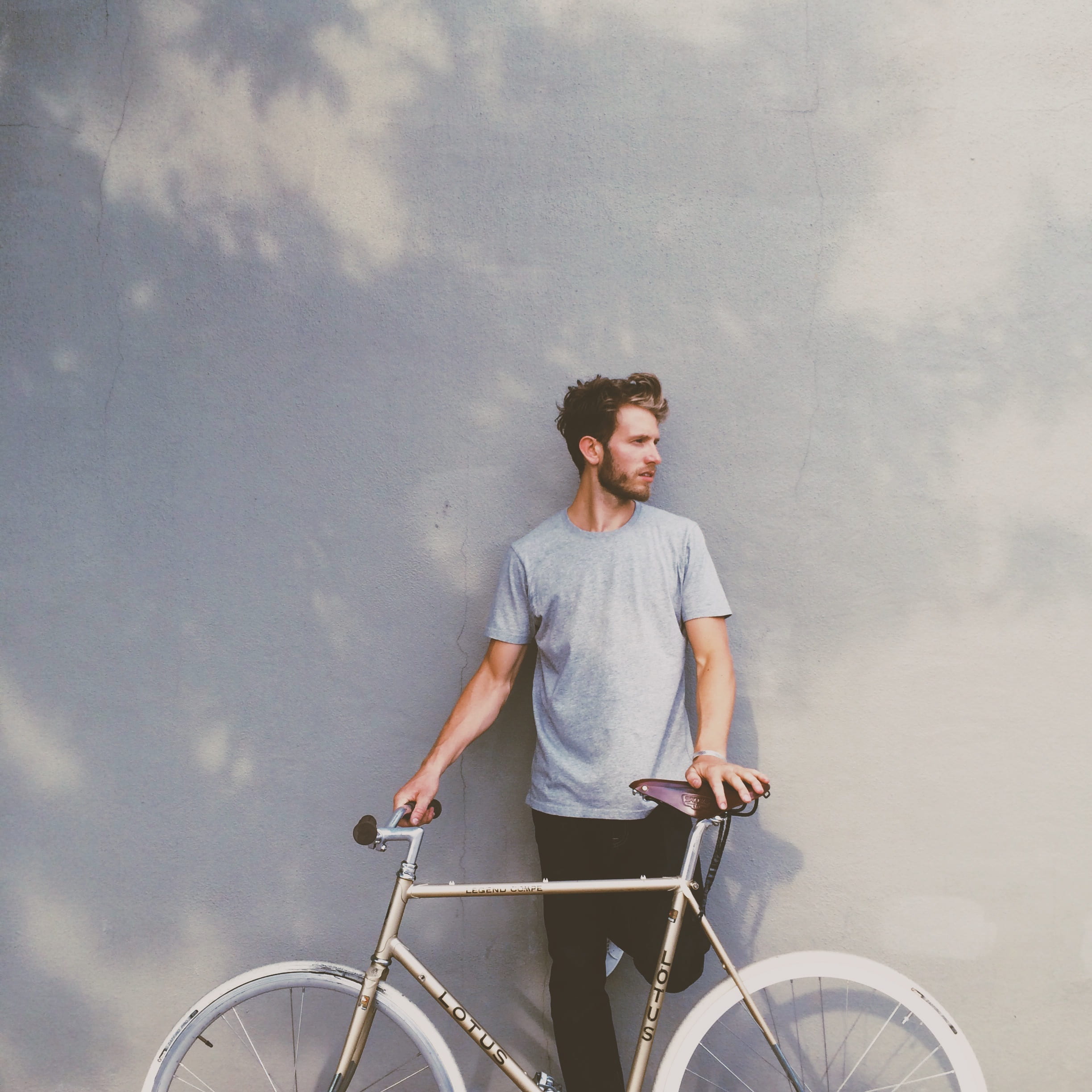 bike, real people, lifestyle, leisure activity, person, day, male, wall, casual, outdoors, young, looking away, three quarter length, adult, cycle, one person, Phone HD Wallpaper