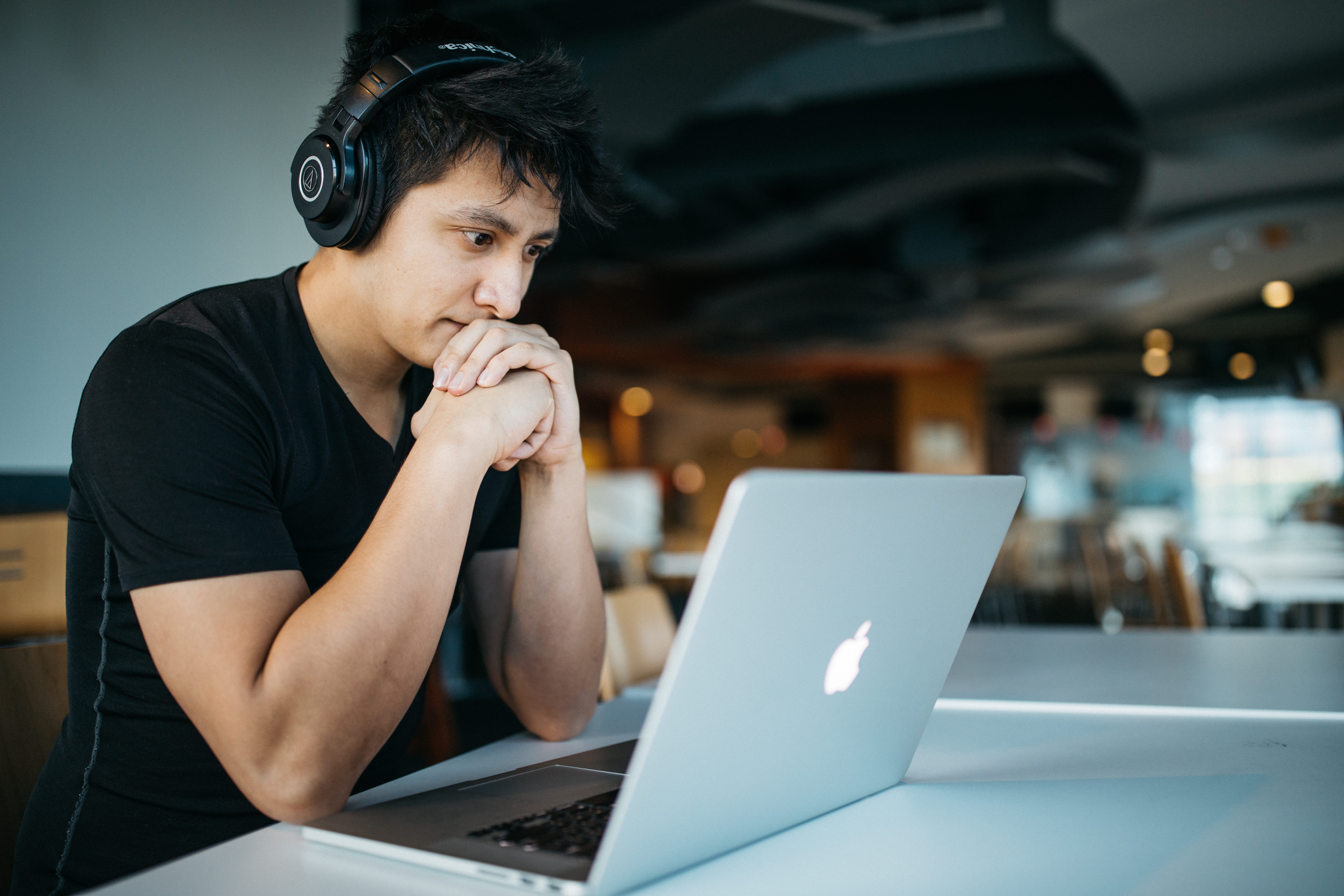 connection, hairstyle, looking, black hair, man, using laptop, chair, head in hands, table, focus on foreground, front, wearing, young adult, computer, HD Wallpaper