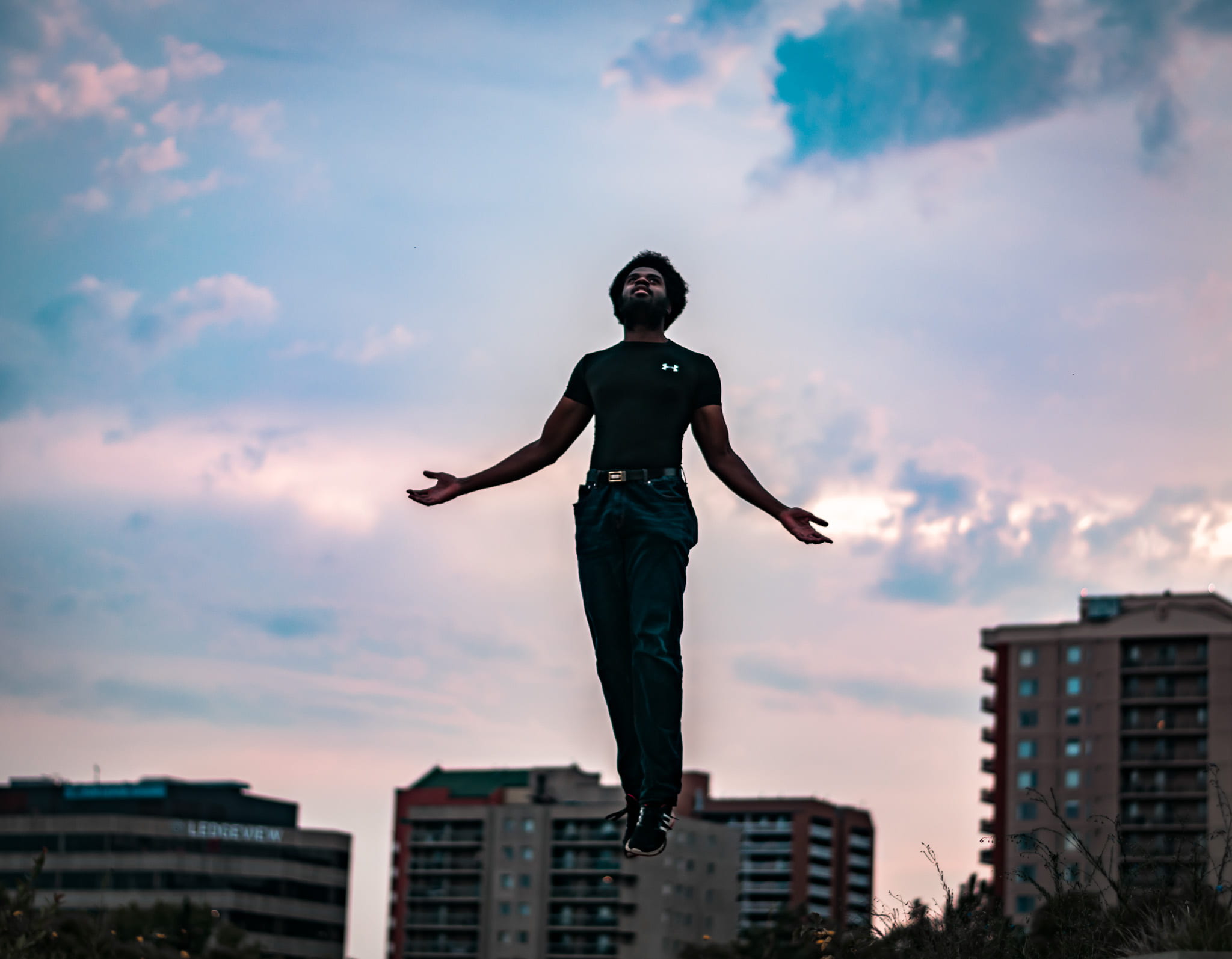 building exterior, nature, low angle view, full length, male, 1080P, near, selective, city, jumping, outdoors, man, sunset, architecture, sky, urban, cloud - sky, HD Wallpaper