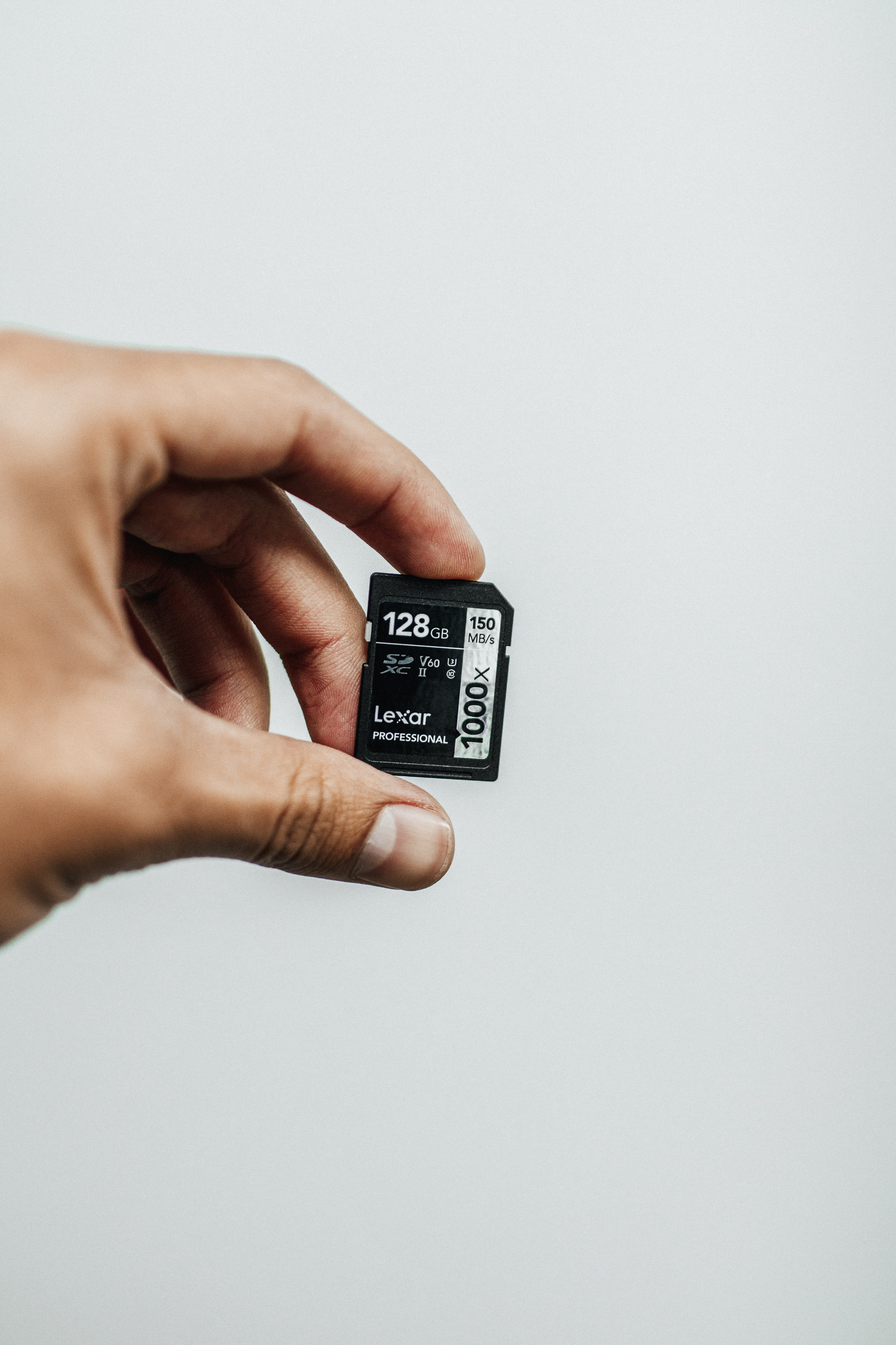 technology, human hand, card, white background, hand, lexar, body part, micro sd, connection, real people, number, copy space, touch, person, studio shot, Phone HD Wallpaper
