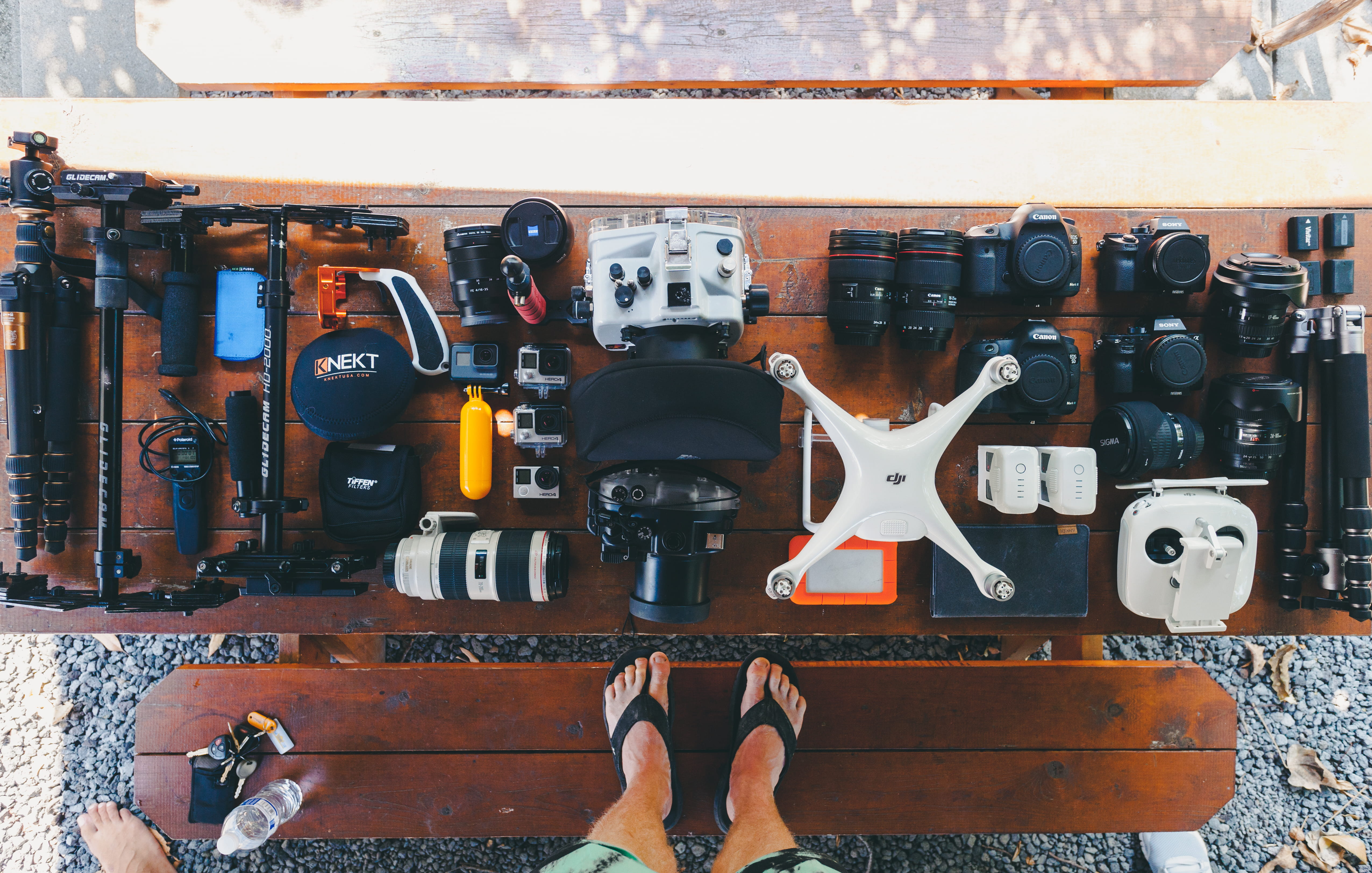 camera, close-up, accessories, brown, quadcopter, industry, people, video gear, 4K, low section, human body part, real people, table, gopro, black, gear flatlay, HD Wallpaper