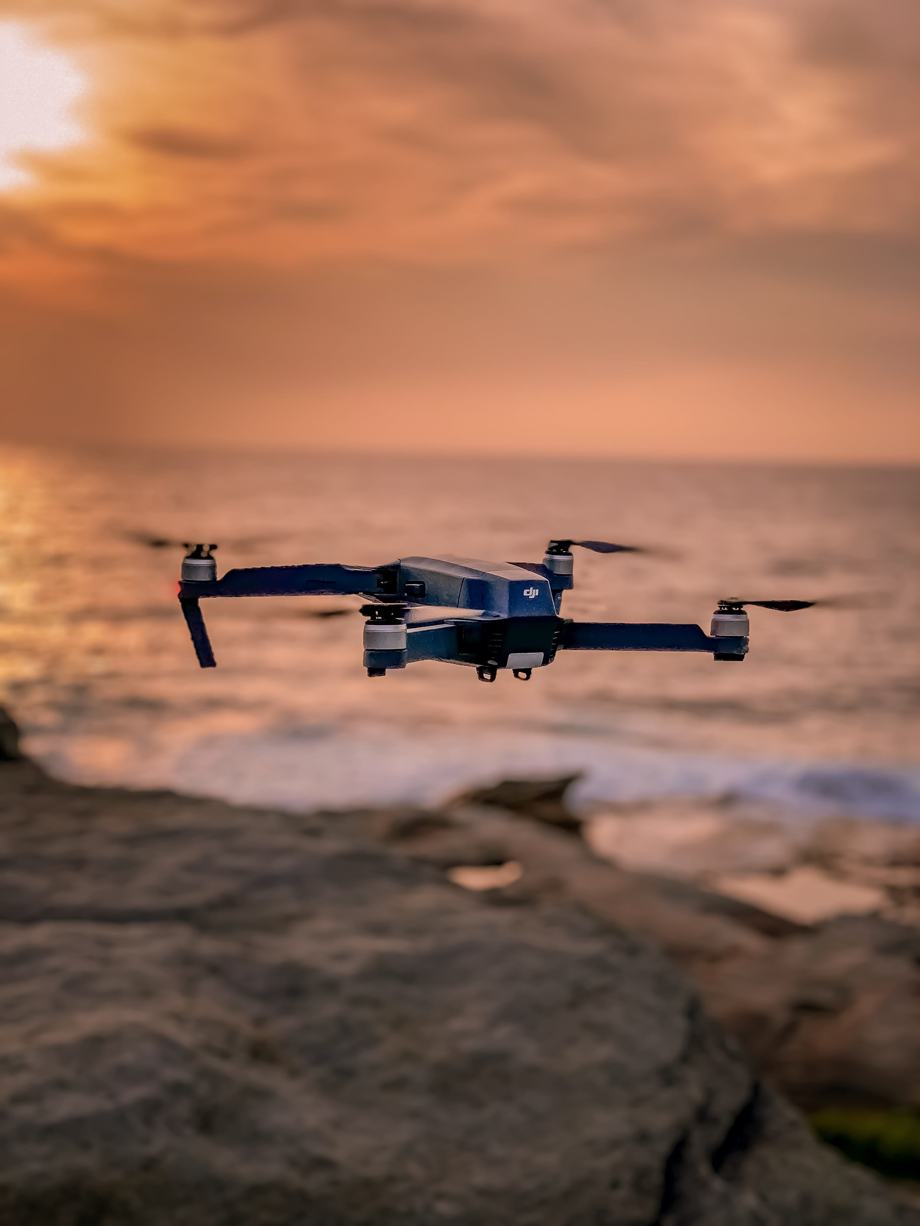 HD, mid-air, mavic, daylight, beauty in nature, rifle, orange color, technology, nature, black, 4K, sun, flight, sea, sunset, dji, brand, landscape, Phone HD Wallpaper